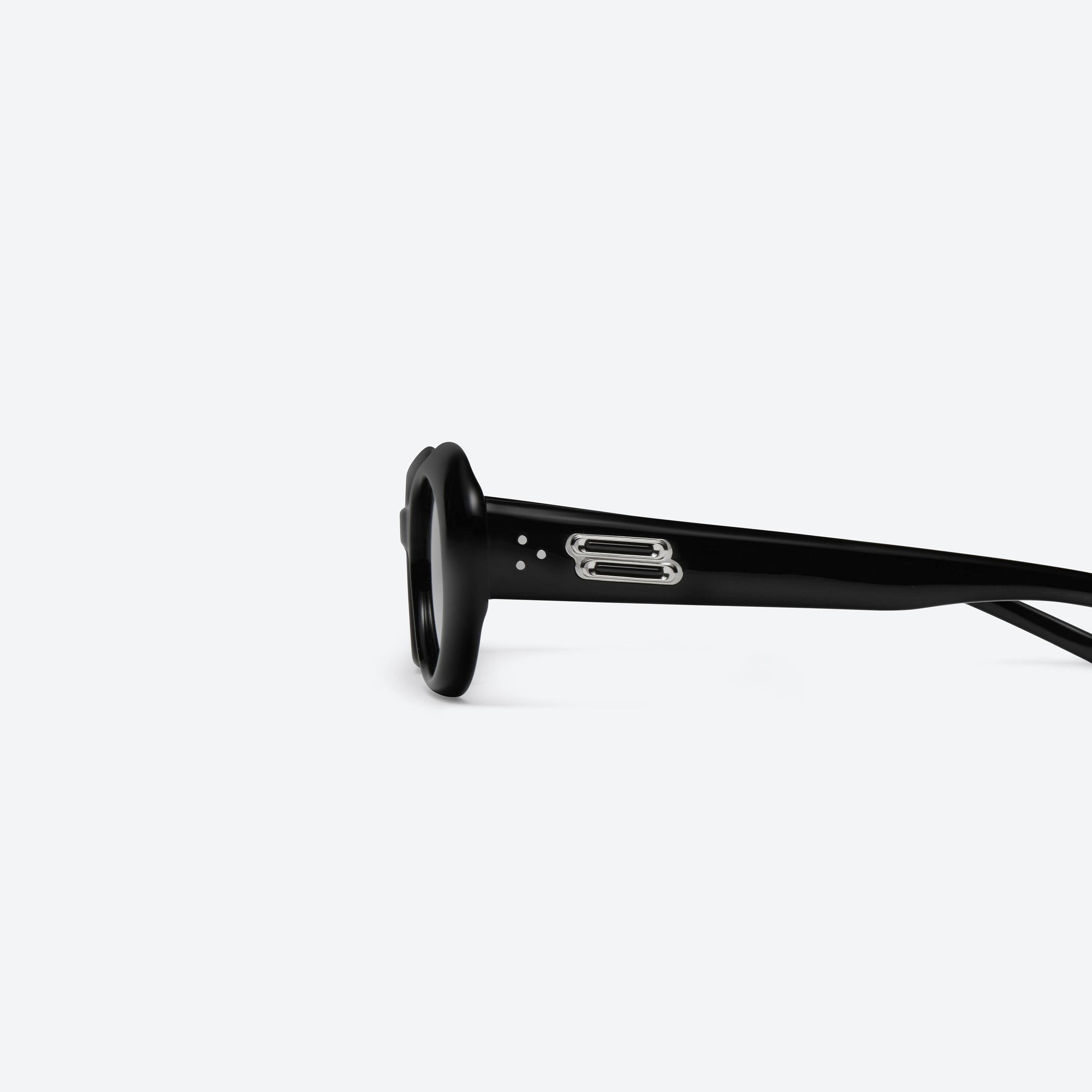 A detailed left view of Gentle Monster Molta 01 Black Acetate framed Oval sunglasses.