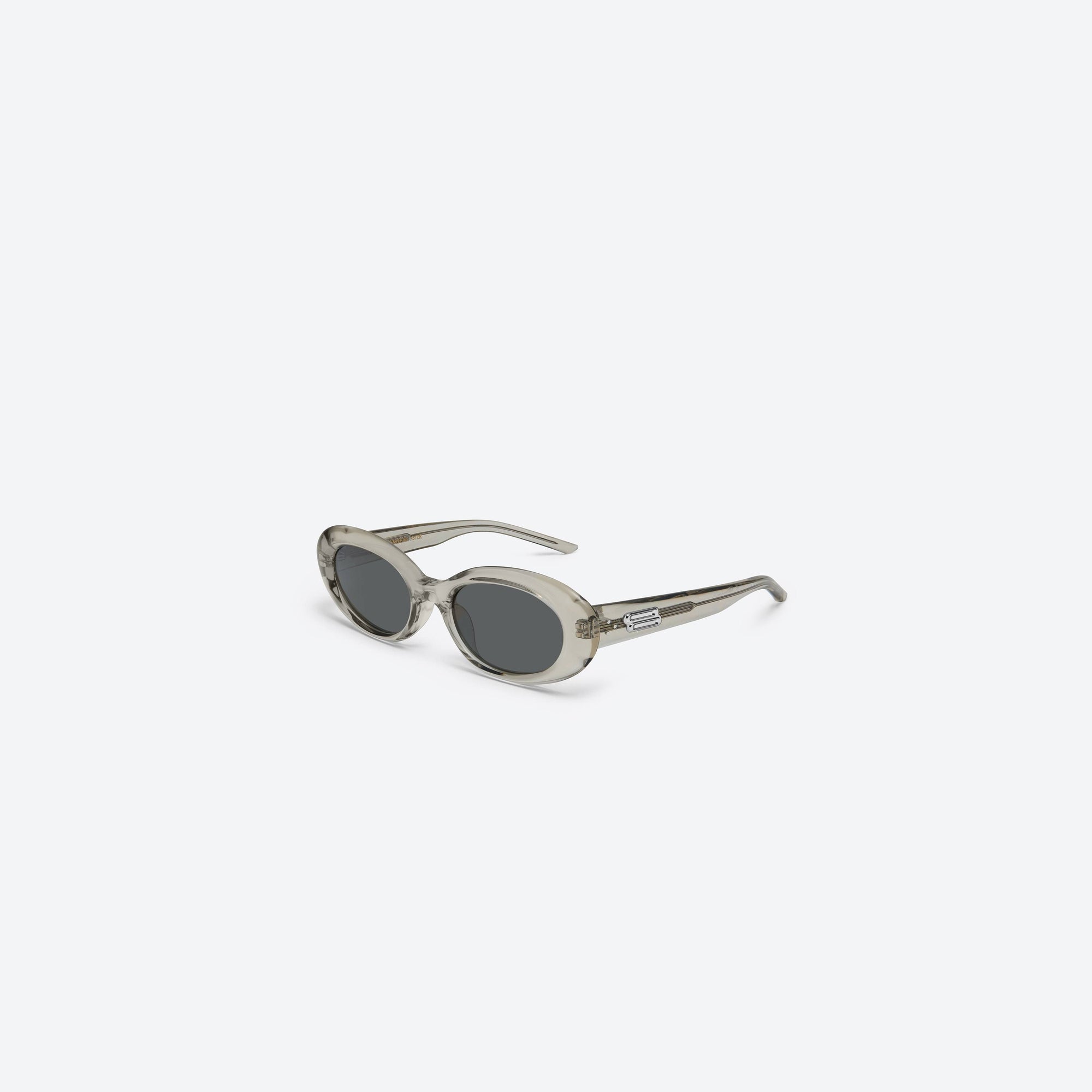 45-degree view of Gentle Monster Molta BRC11 Brown Acetate framed Oval sunglasses.