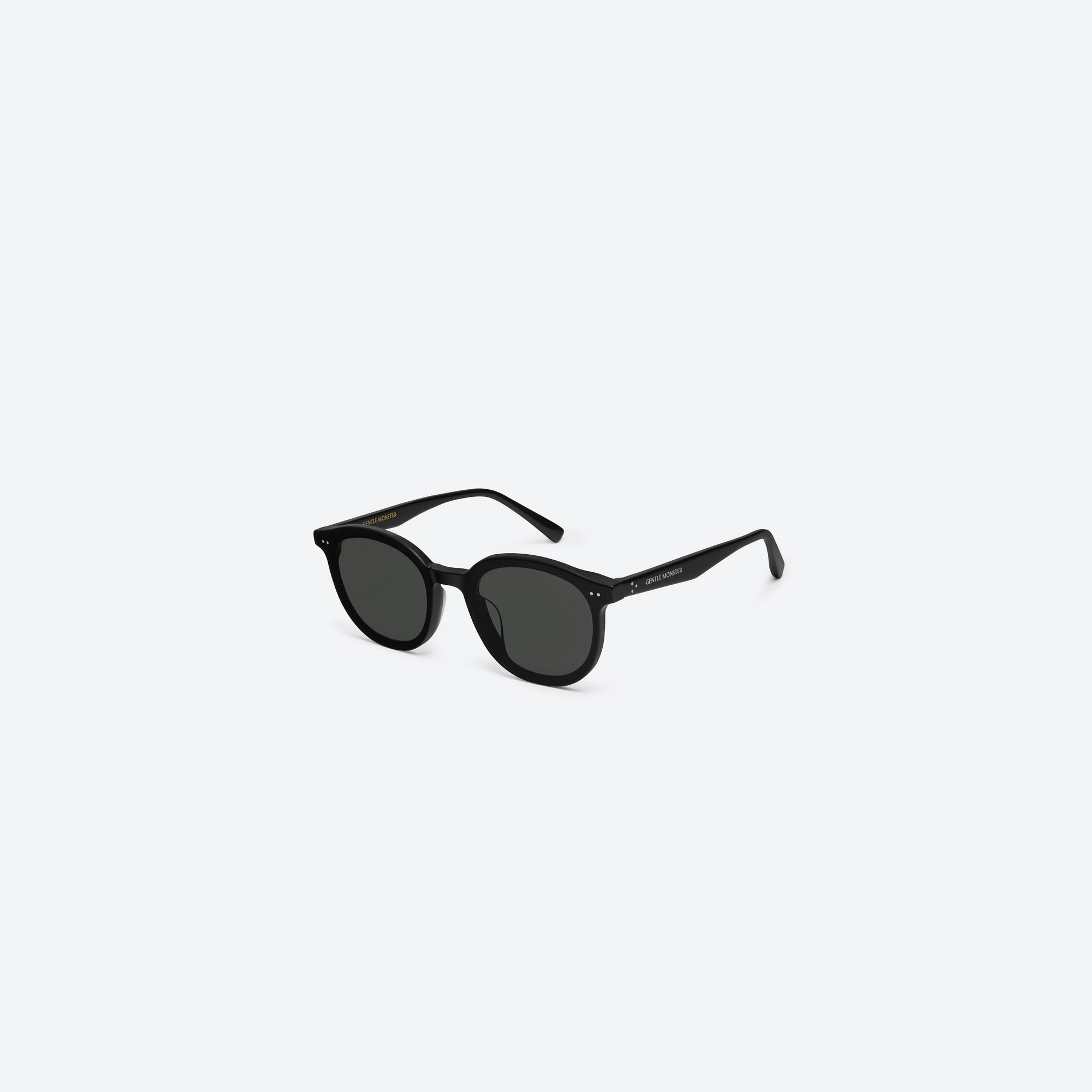 45-degree view of Gentle Monster New Born 01 Black Acetate framed Round sunglasses.