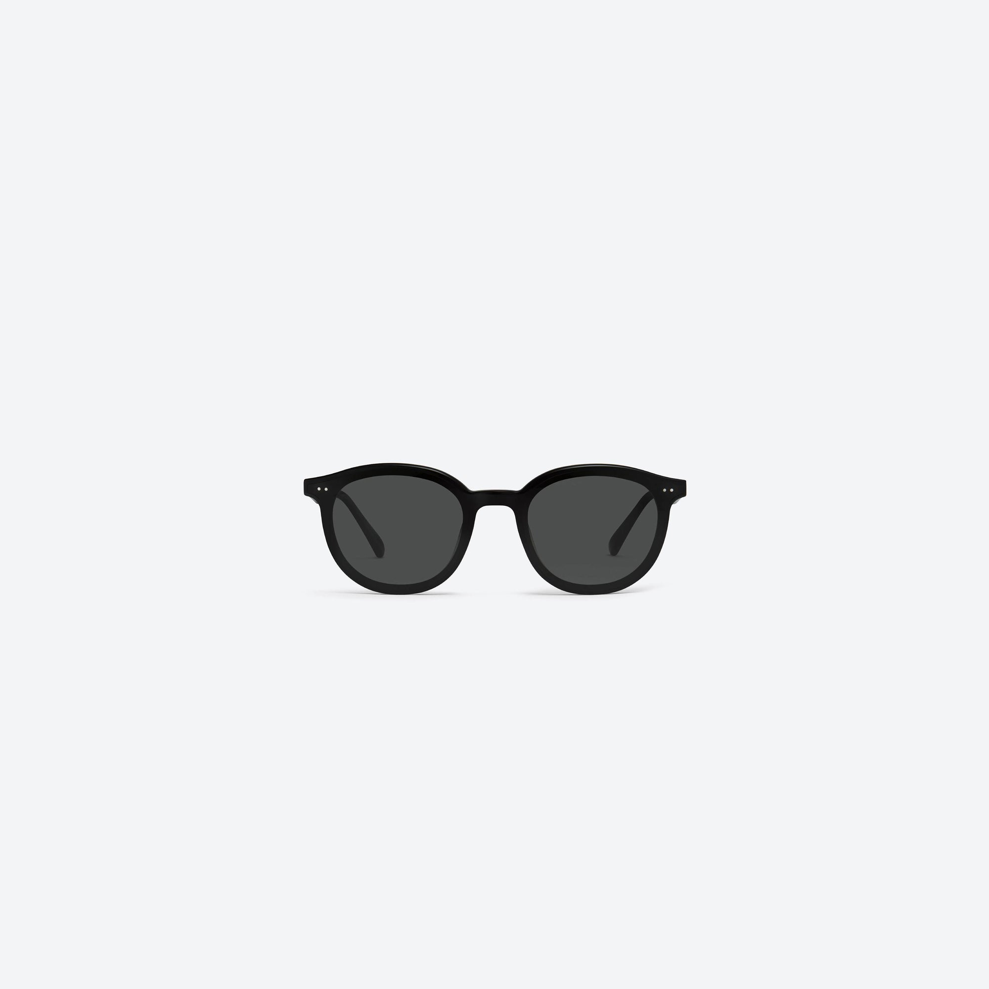 A front view of Gentle Monster New Born 01 Black Acetate framed Round sunglasses.
