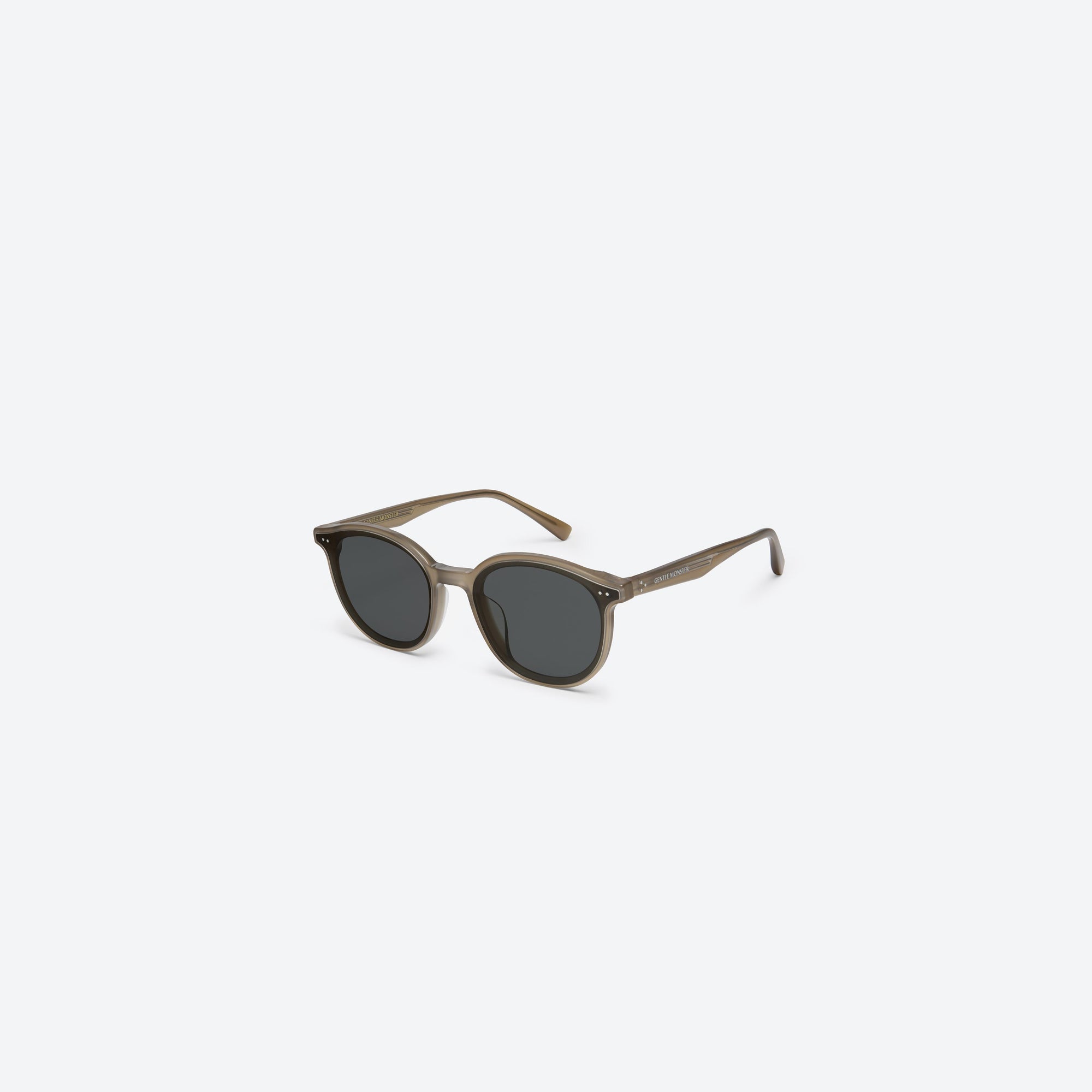 45-degree view of Gentle Monster New Born BRC9 Brown Acetate framed Round sunglasses.