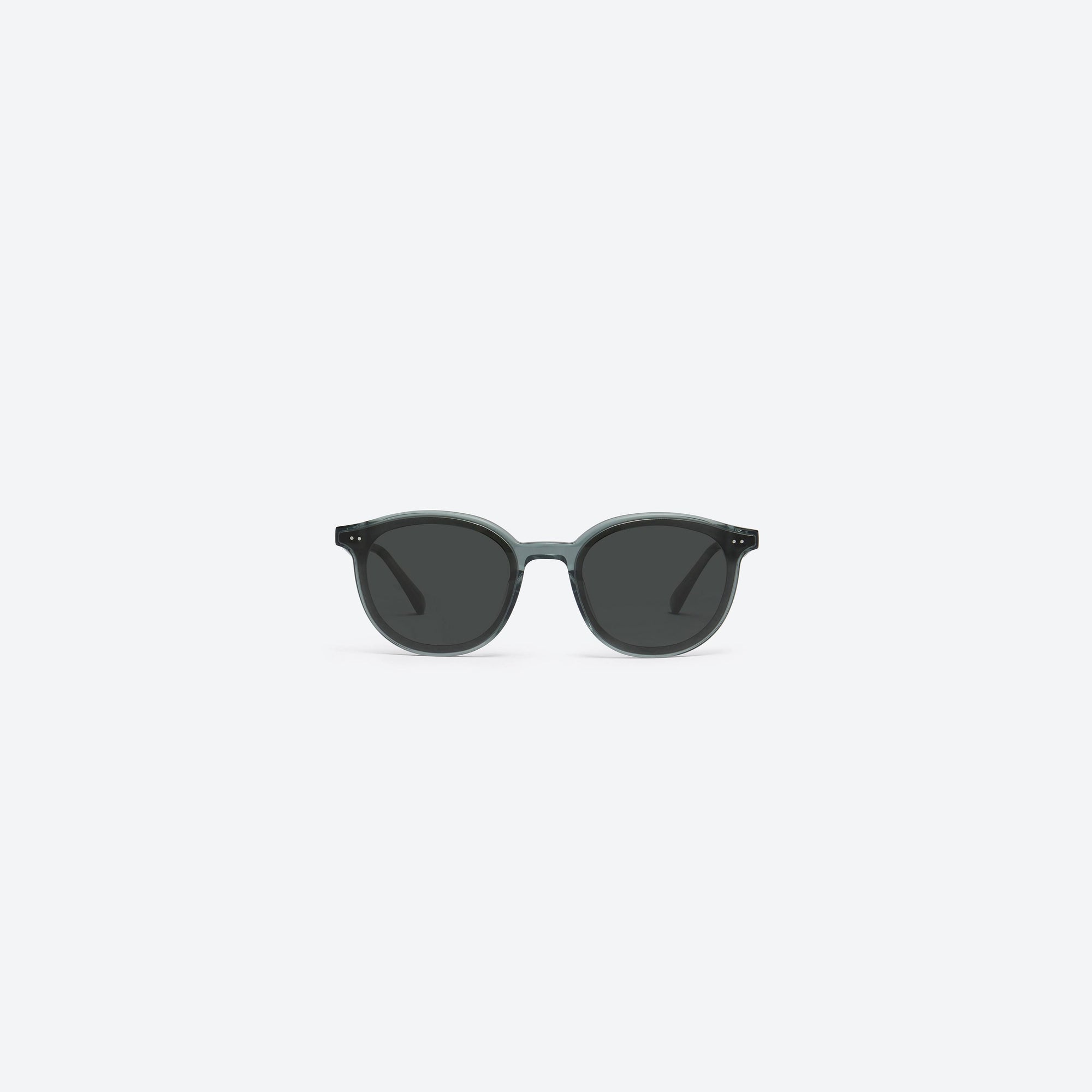 A front view of Gentle Monster New Born G3 Gray Acetate framed Round sunglasses.