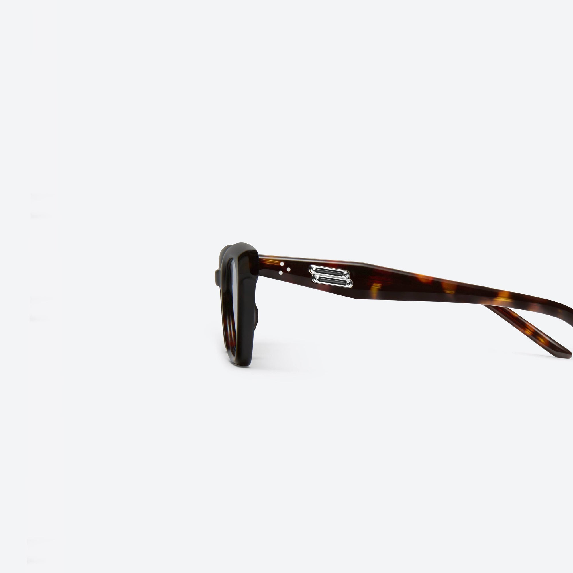 A detailed left view of Gentle Monster Nonn T1 Tortoise Acetate framed Cat-eye sunglasses.