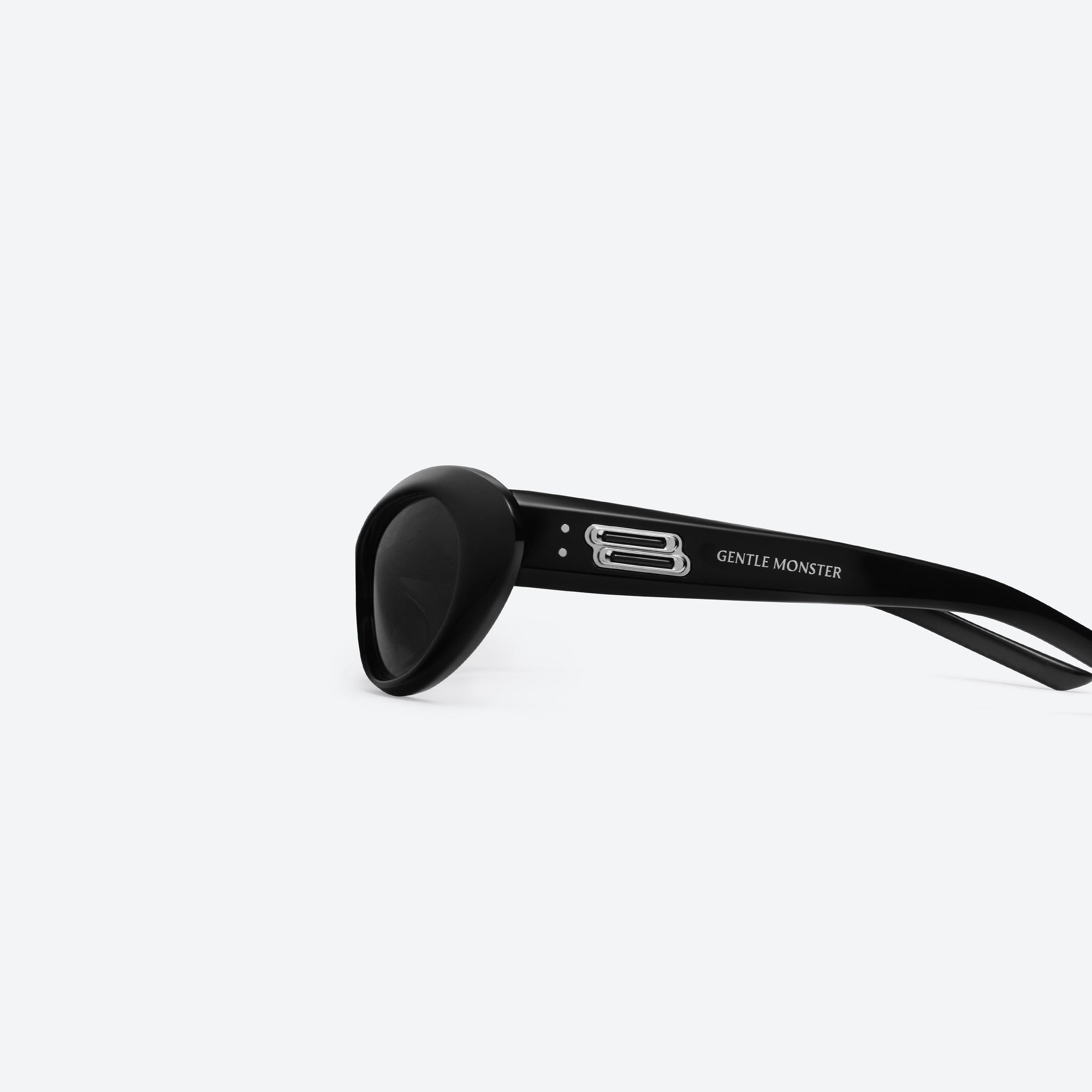 A detailed left view of Gentle Monster Nova 01 Black Acetate framed Wraparound sunglasses.