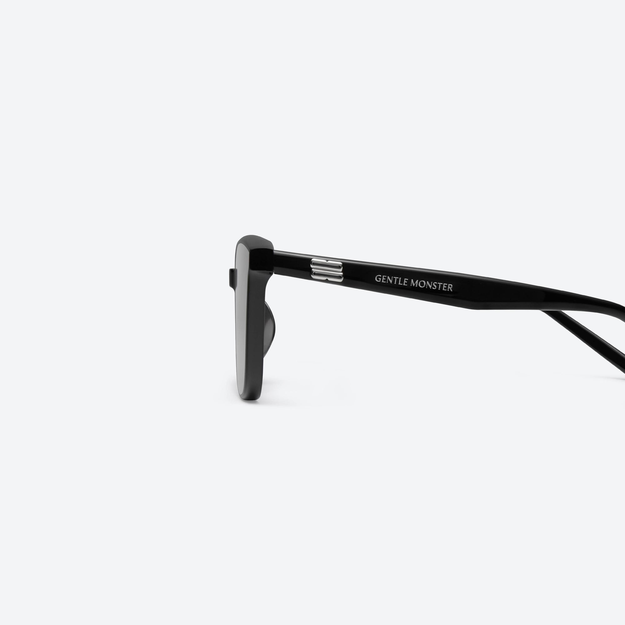 A detailed left view of Gentle Monster Pino 01 Black Acetate framed Square sunglasses.