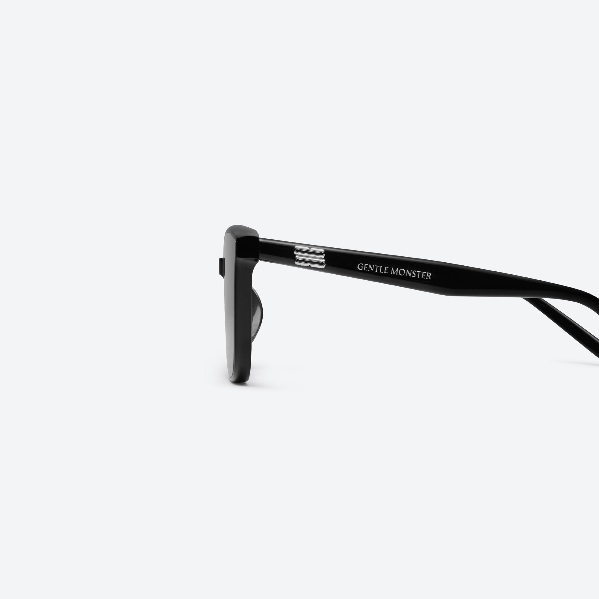 A detailed left view of Gentle Monster Pino 01(BR) Black Acetate framed Square sunglasses.