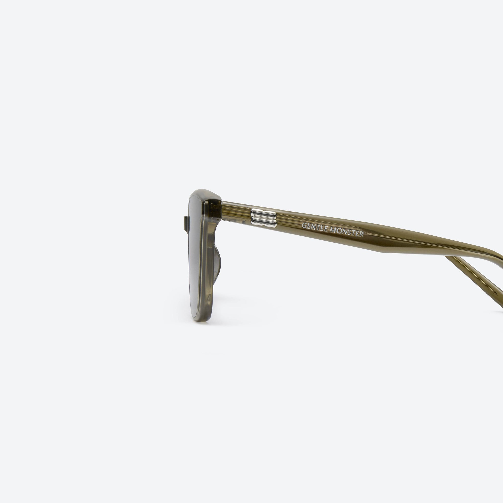 A detailed left view of Gentle Monster Pino KC1 Green Acetate framed Square sunglasses.