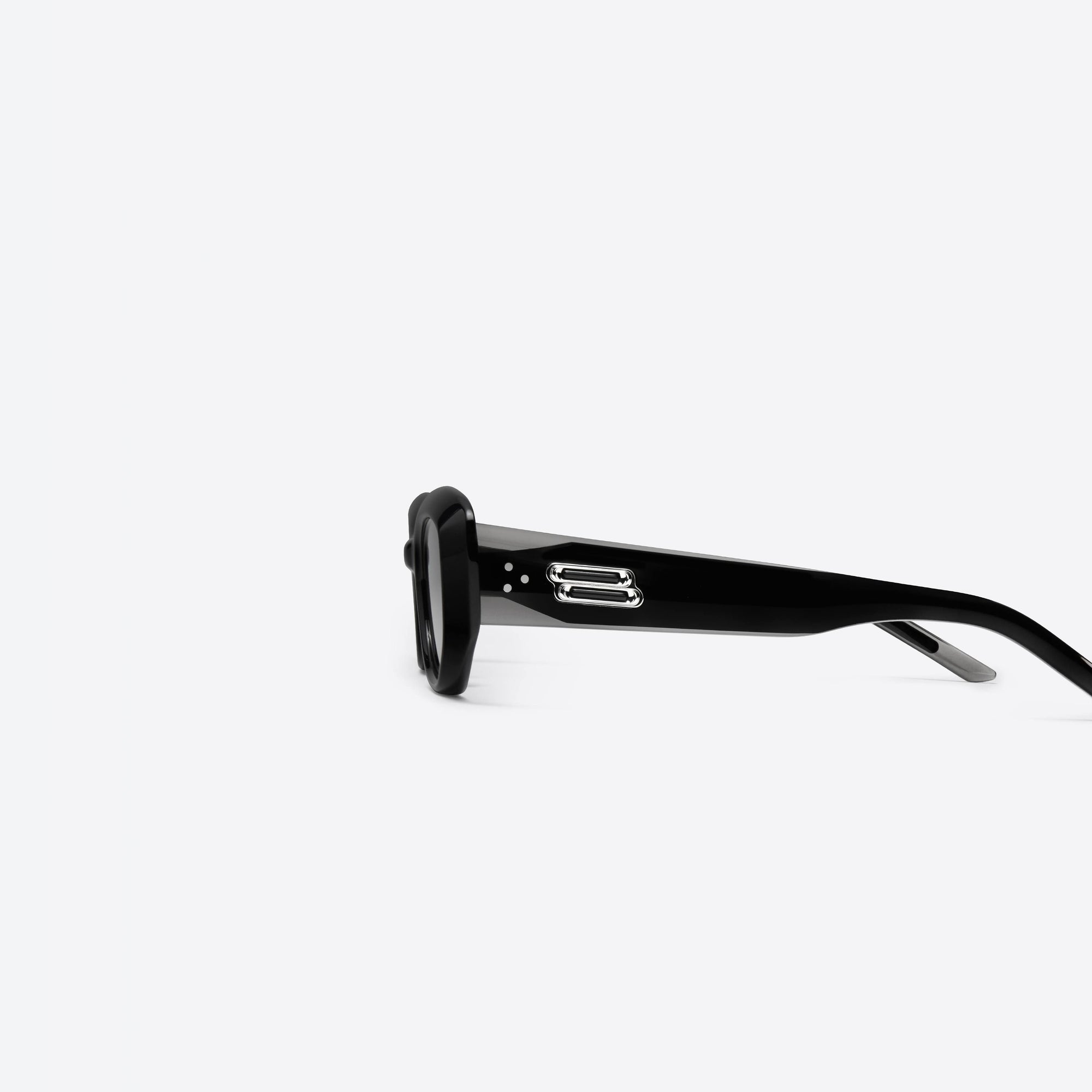 A detailed left view of Gentle Monster Row 01 Black Acetate framed Square sunglasses.