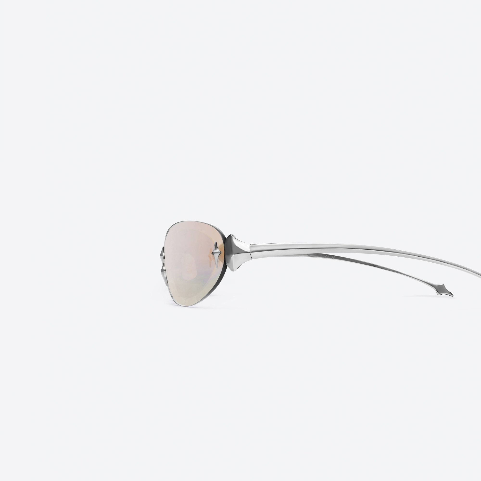 A detailed left view of Gentle Monster Tta 02 Silver Metal framed Oval sunglasses.