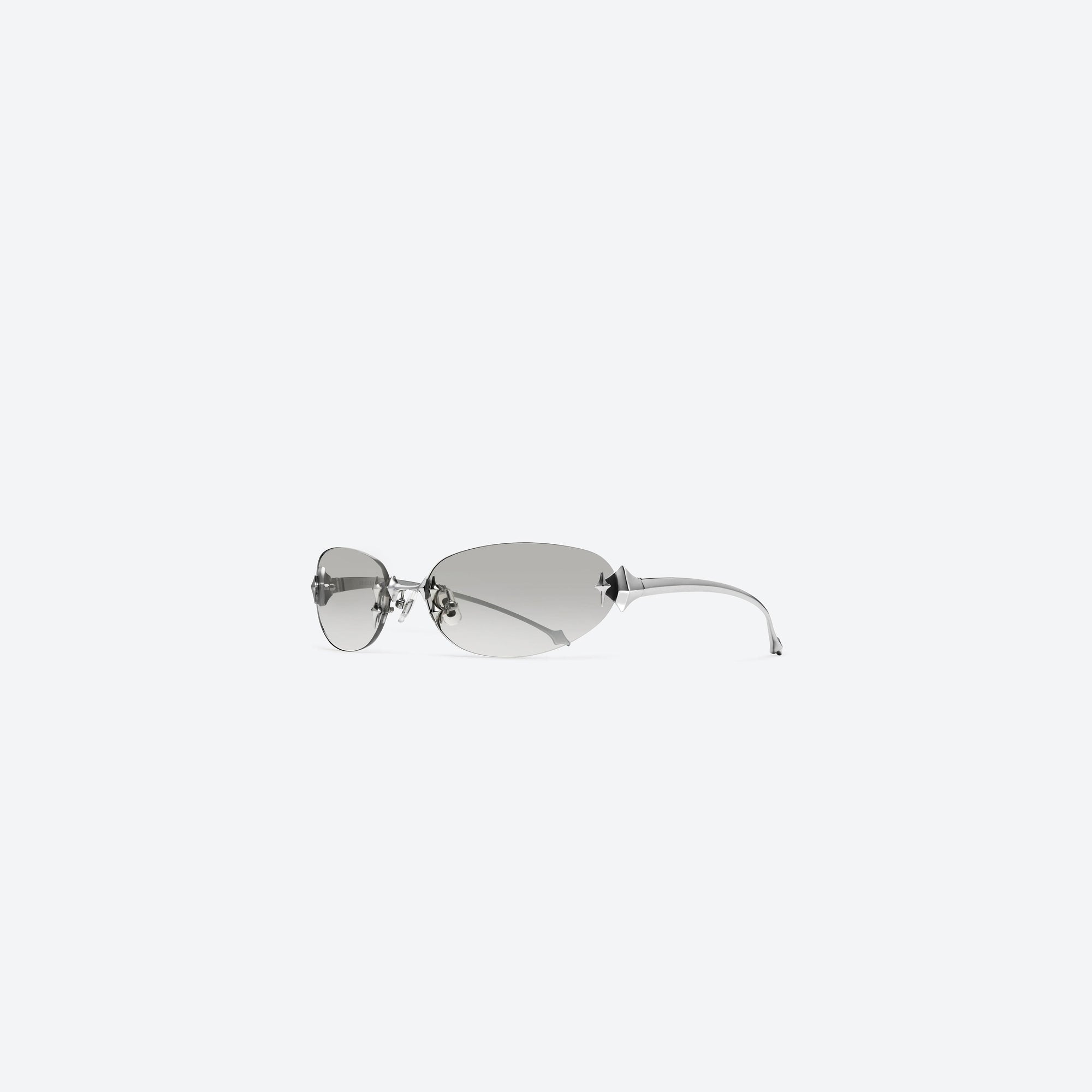 45-degree view of Gentle Monster Tta 02(BRG) Silver Metal framed Oval sunglasses.