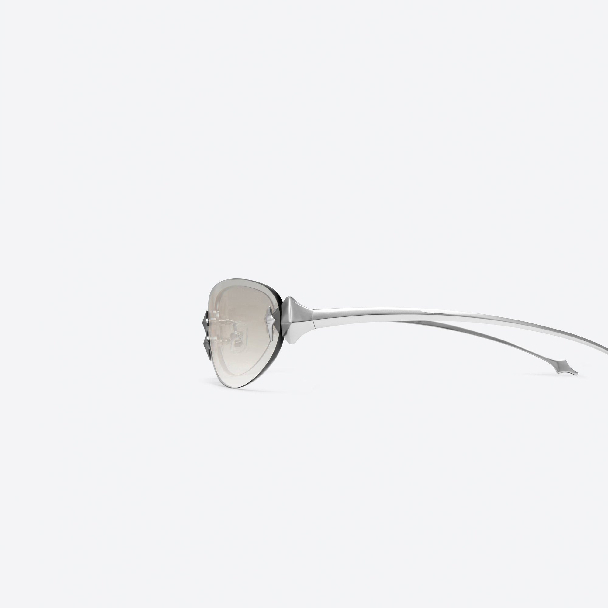 A detailed left view of Gentle Monster Tta 02(BRG) Silver Metal framed Oval sunglasses.