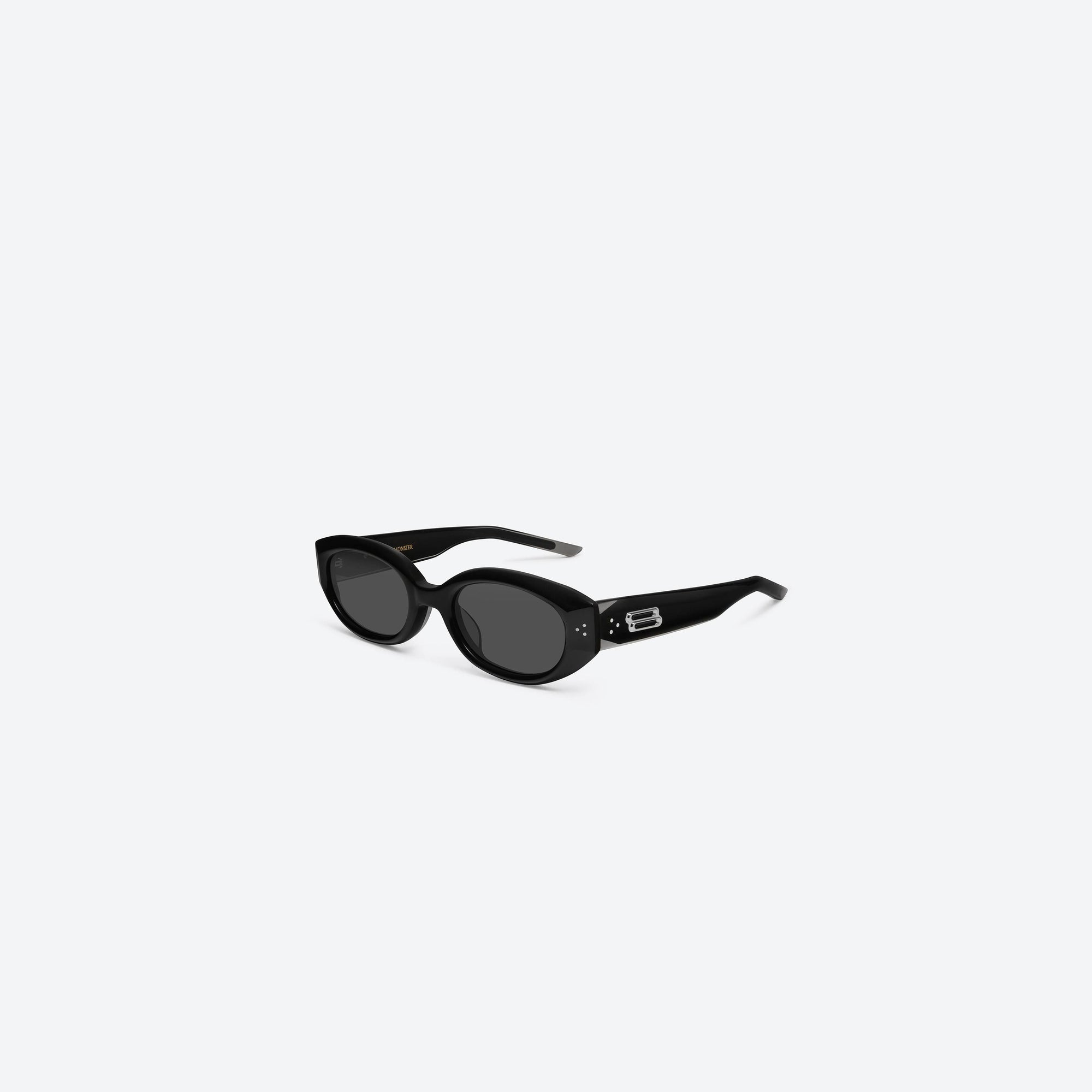 45-degree view of Gentle Monster Void 01 Black Acetate framed Oval sunglasses.