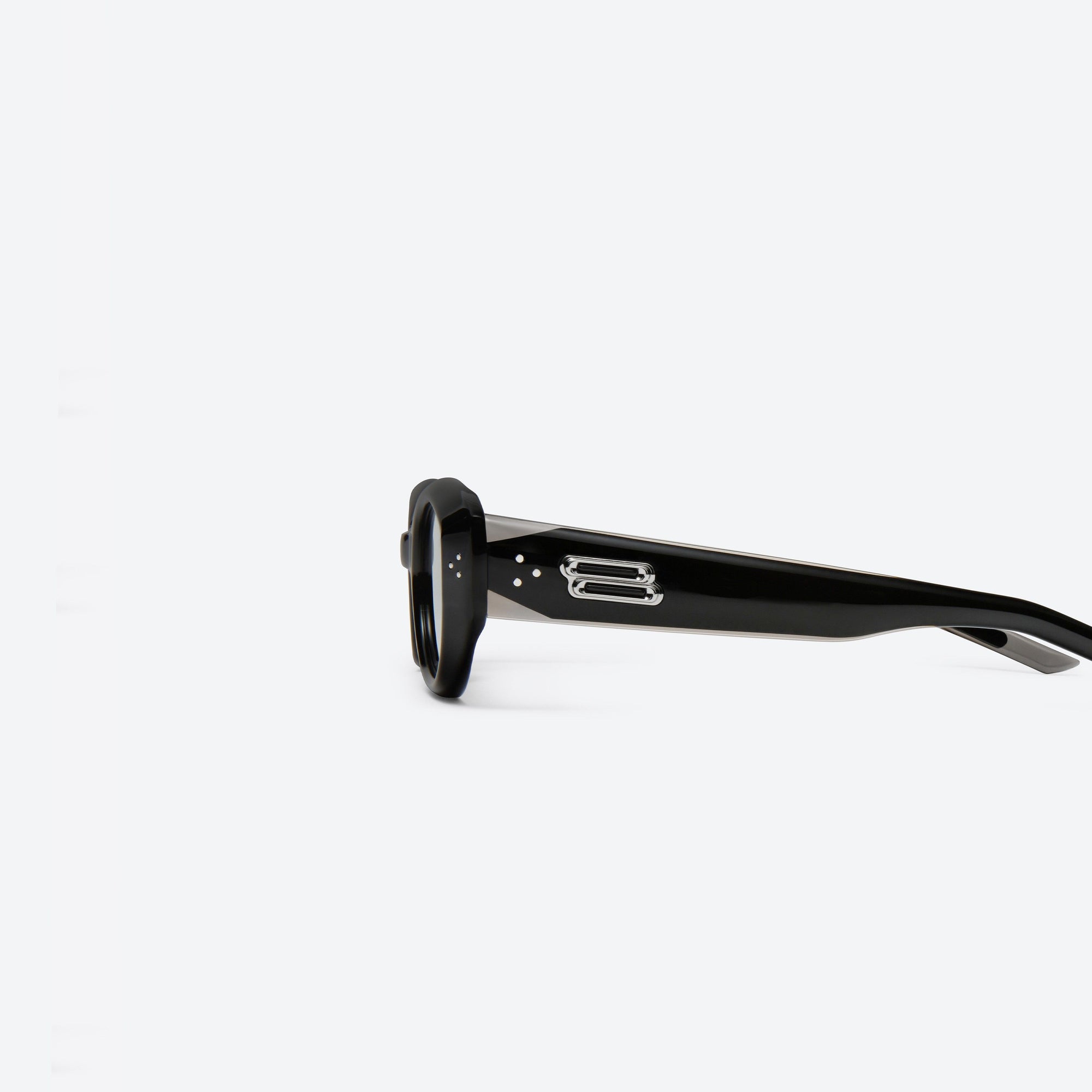 A detailed left view of Gentle Monster Void 01 Black Acetate framed Oval sunglasses.