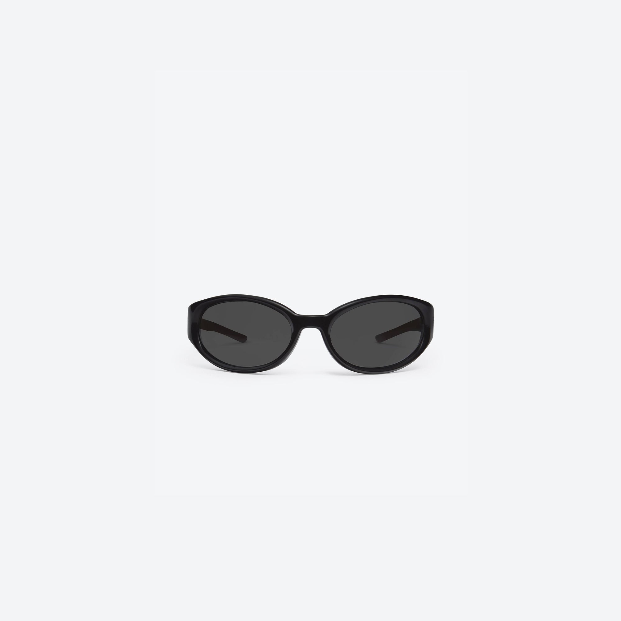 A front view of Gentle Monster Young 01 Black Acetate framed Wraparound sunglasses.