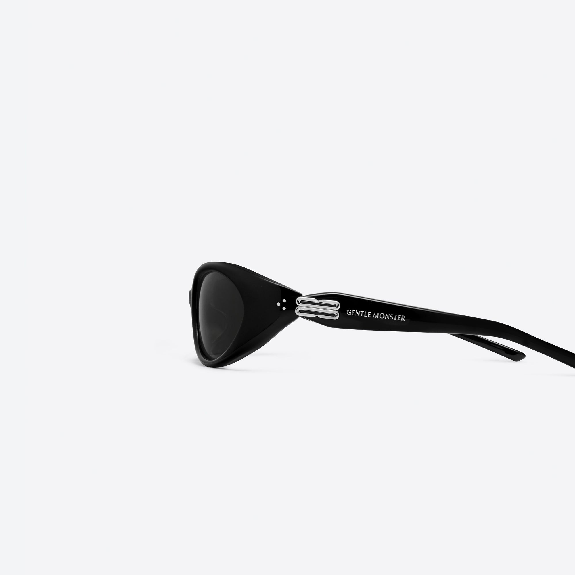 A detailed left view of Gentle Monster Atempo 01 Black Acetate framed Wraparound sunglasses.