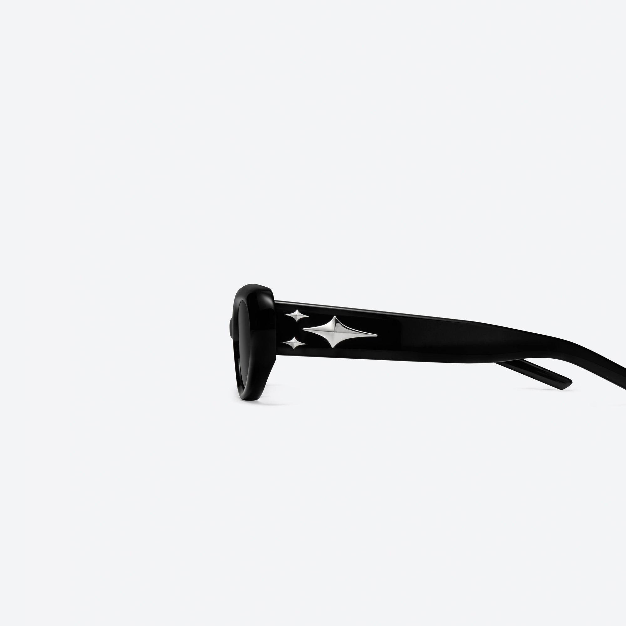 A detailed left view of Gentle Monster Cuff 01 Black Acetate framed Oval sunglasses.