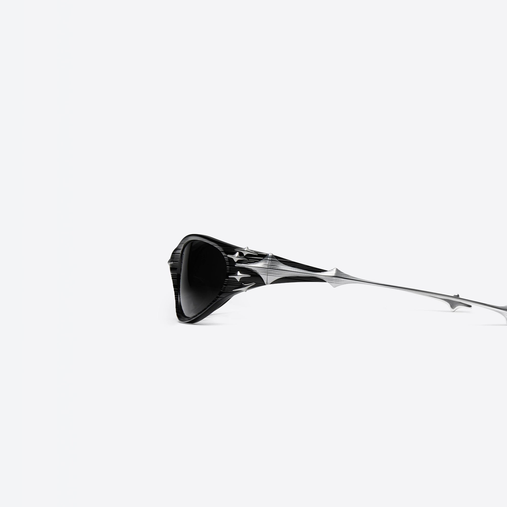 A detailed left view of Gentle Monster Ex S01 Black Mixed framed Wraparound sunglasses.