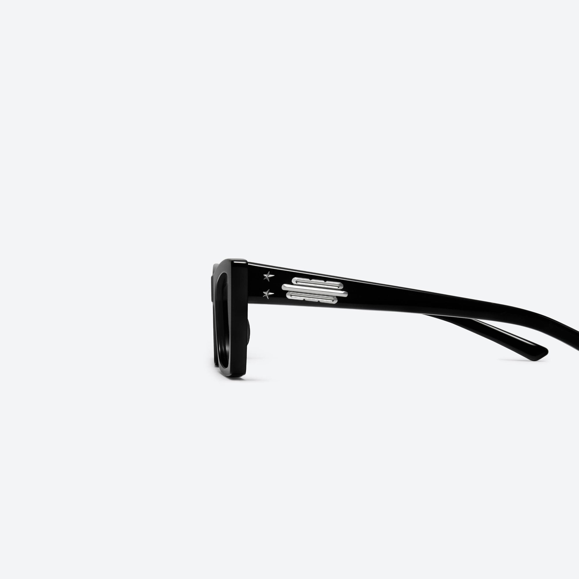 A detailed left view of Gentle Monster Jennie - Baby Pony 01 Black Acetate framed Cat-eye sunglasses.