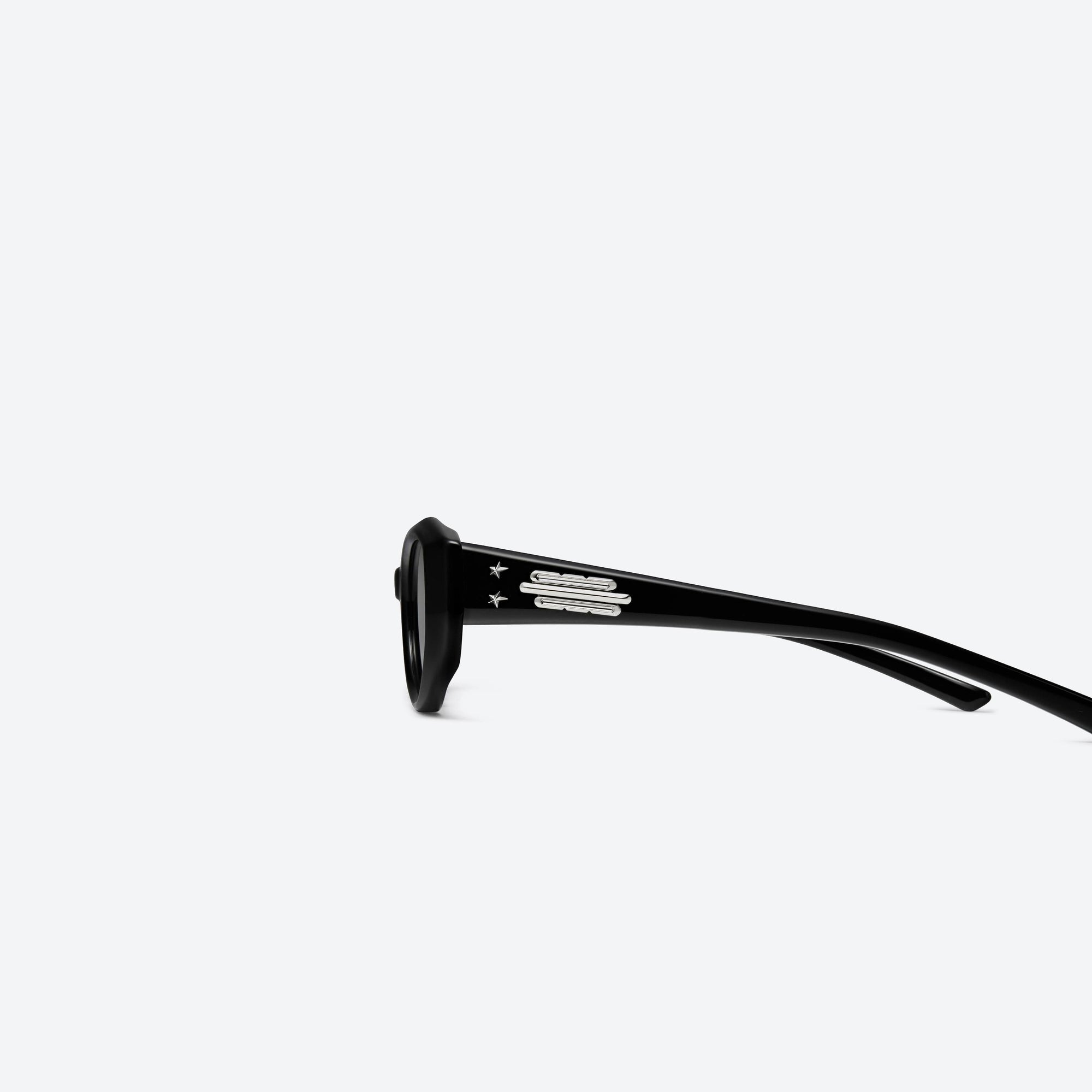 A detailed left view of Gentle Monster Jennie - Fish Tail 01 Black Acetate framed Cat-eye sunglasses.