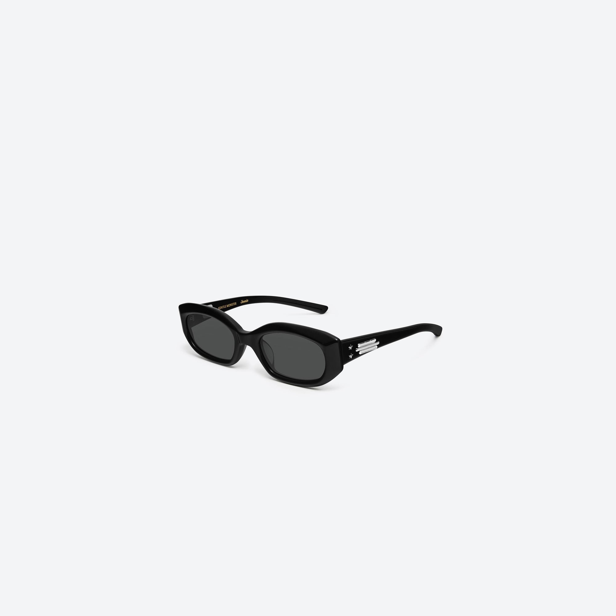 45-degree view of Gentle Monster Jennie - Wispy 01 Black Acetate framed Square sunglasses.