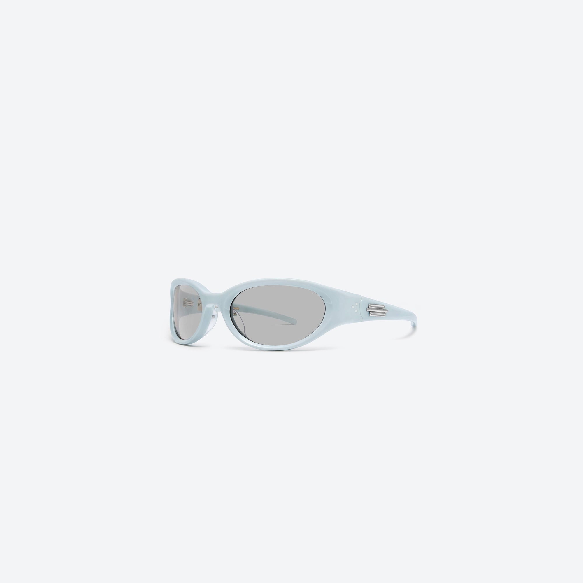 45-degree view of Gentle Monster Jennie - Donut Bun BL5 Blue Acetate framed Wraparound sunglasses.