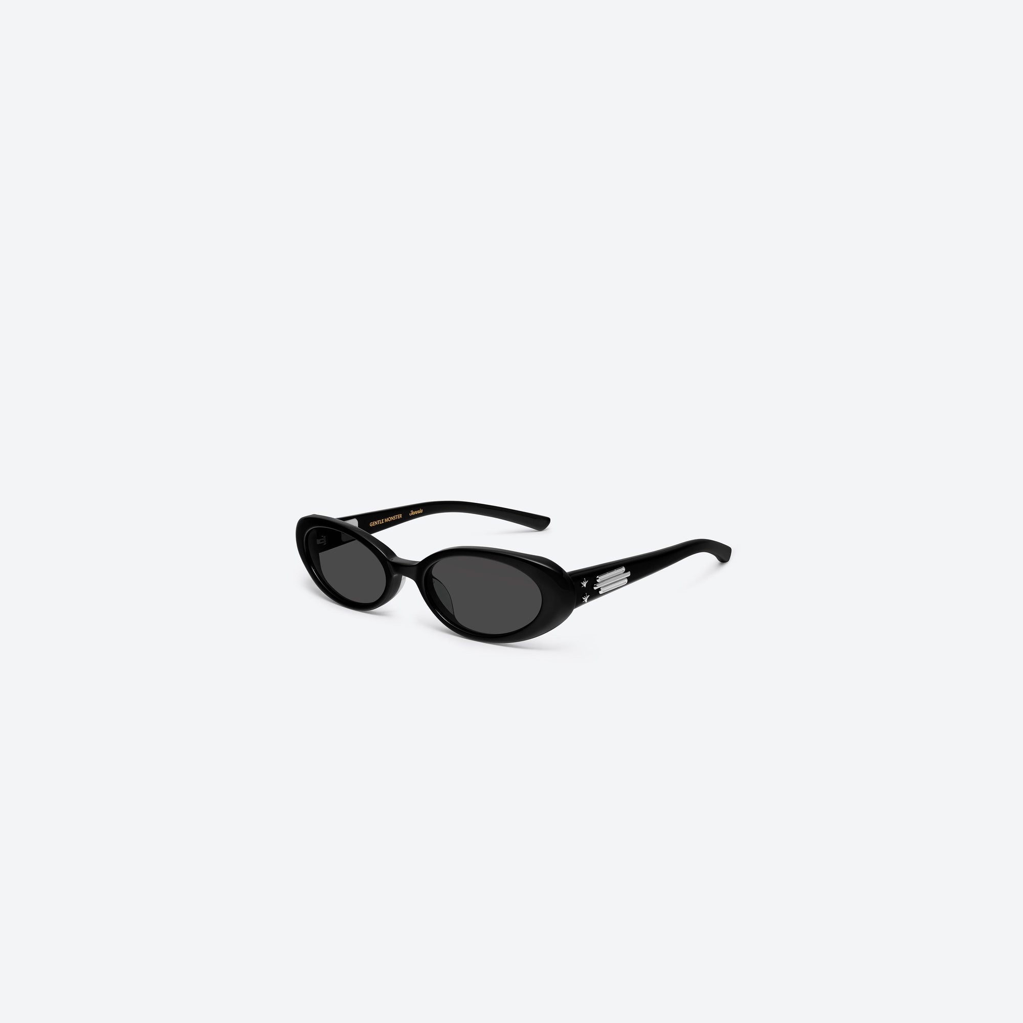 45-degree view of Gentle Monster Jennie - Hush 01 Black Acetate framed Oval sunglasses.