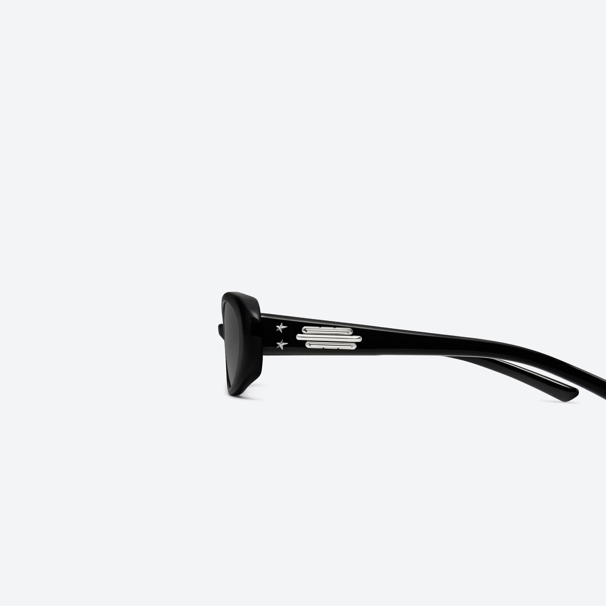 A detailed left view of Gentle Monster Jennie - Hush 01 Black Acetate framed Oval sunglasses.