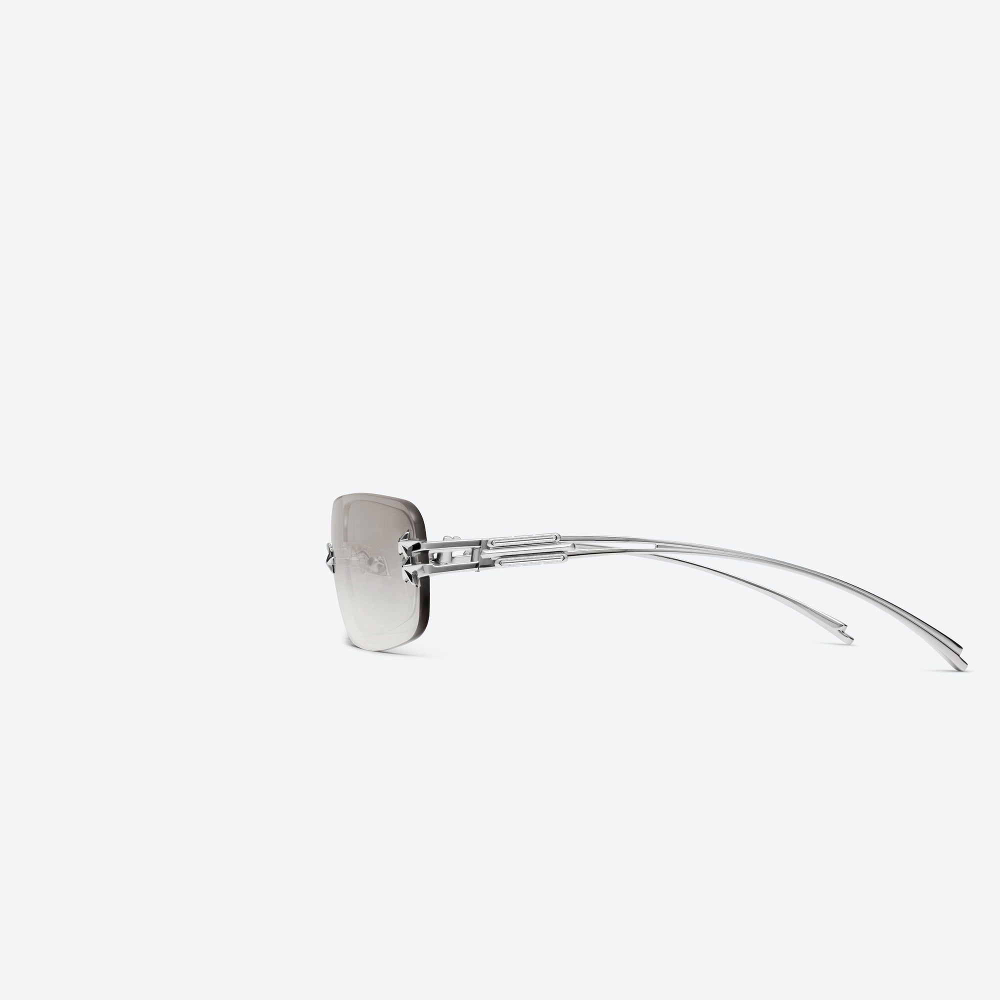 A detailed left view of Gentle Monster Jennie - Glitter 02 Silver Metal framed Square sunglasses.