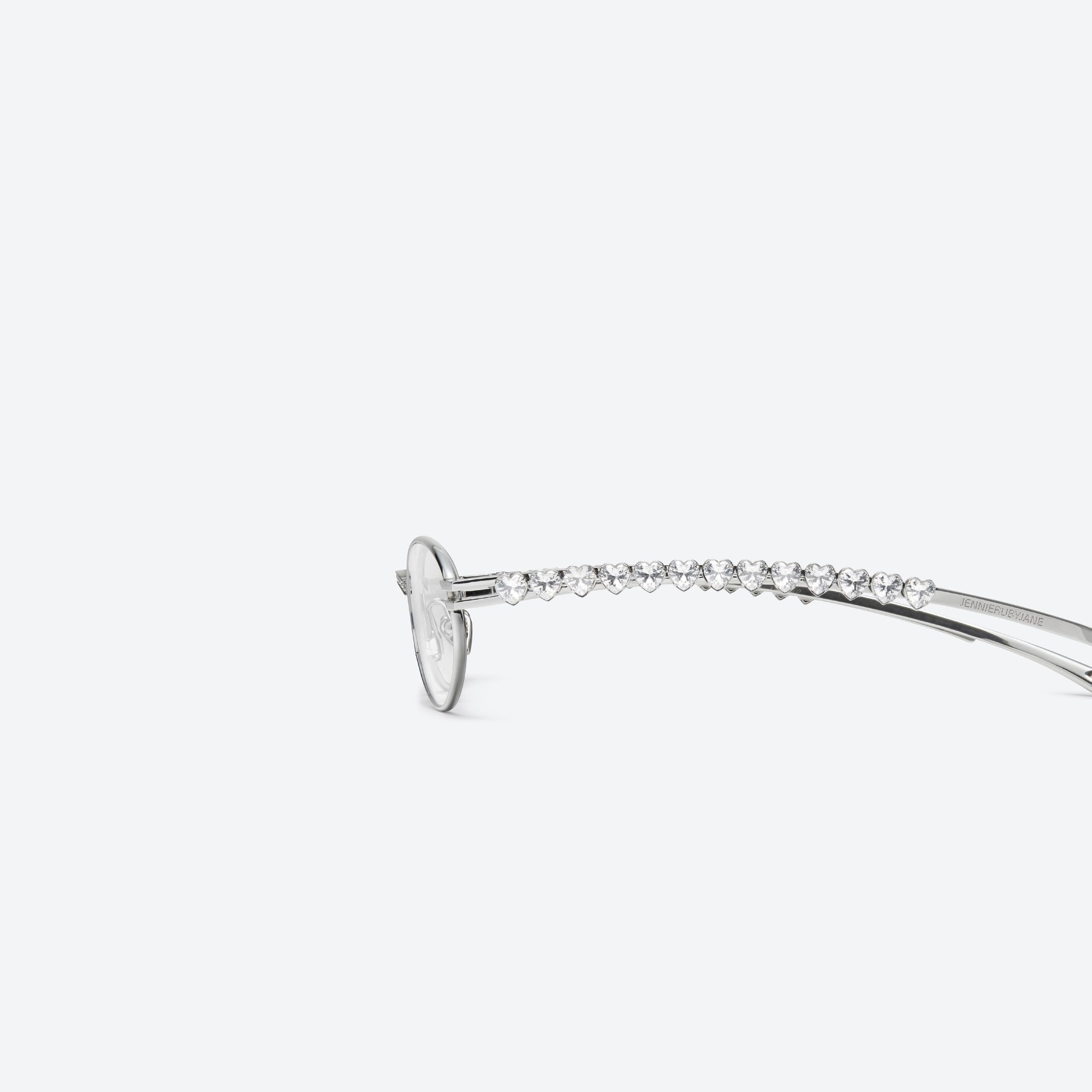 A detailed left view of Gentle Monster Jennie - Barrette 02 Silver Metal framed Oval sunglasses.