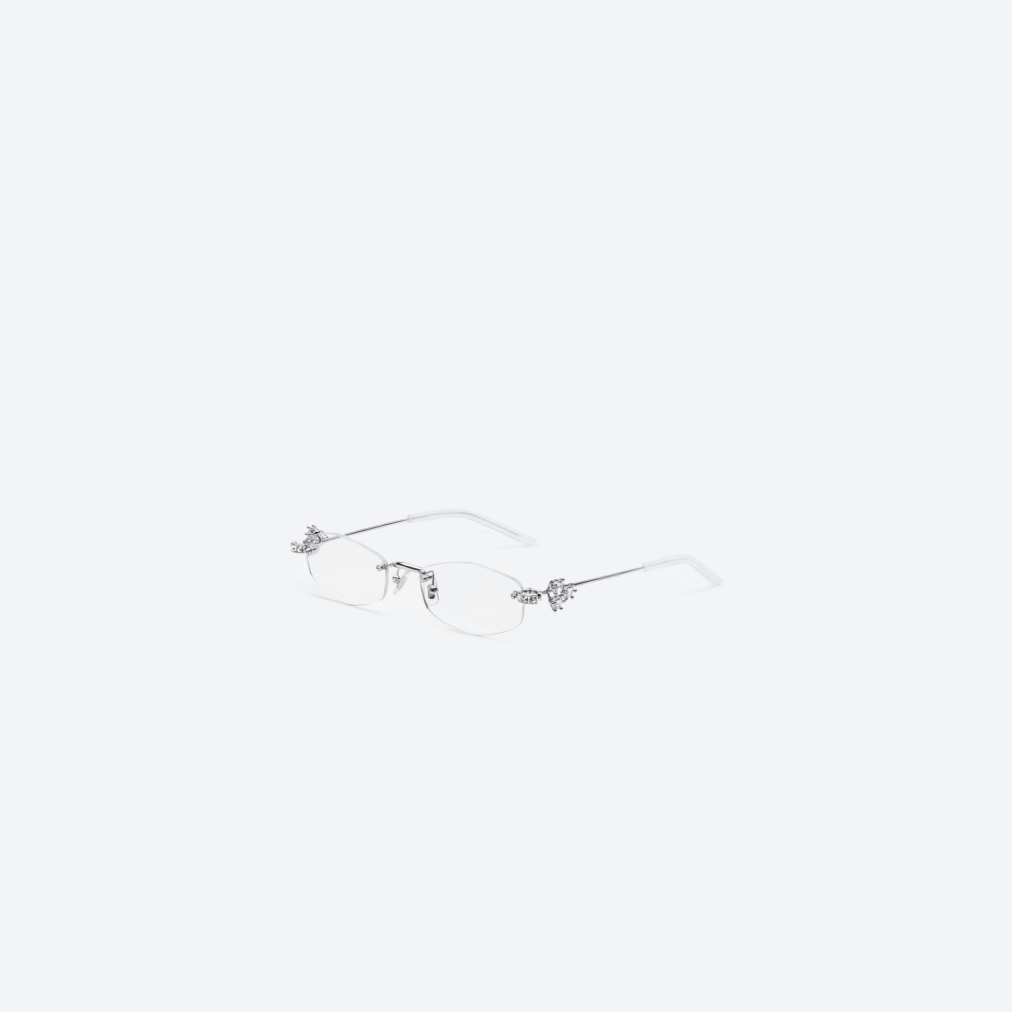 45-degree view of Gentle Monster Glitz 02 Silver Metal framed Oval sunglasses.