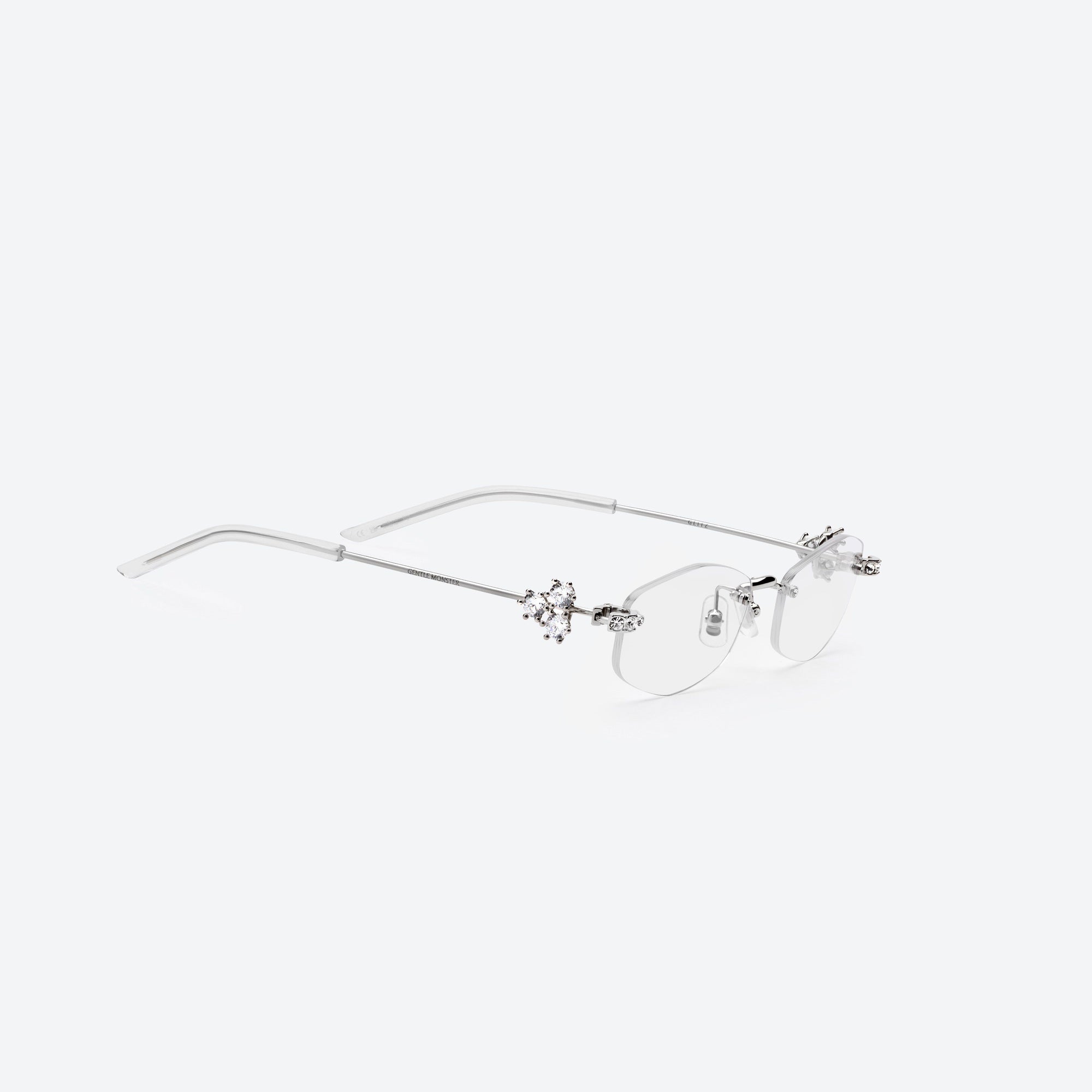 45-degree detailed view of Gentle Monster Glitz 02 Silver Metal framed Oval sunglasses.
