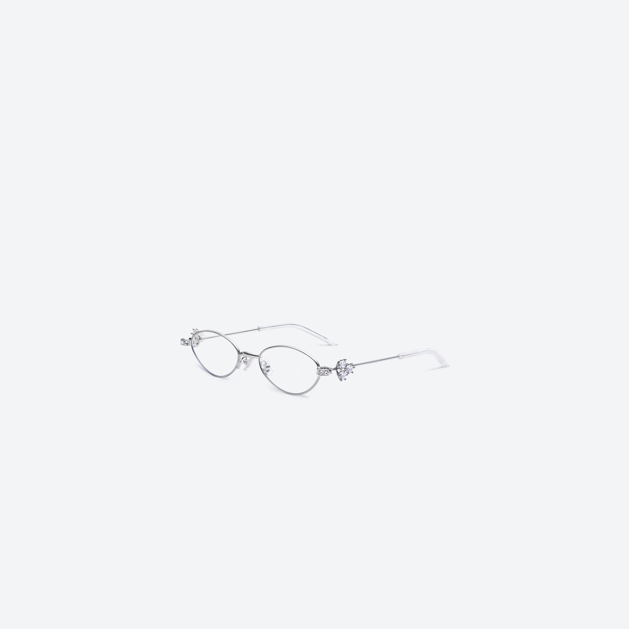 45-degree view of Gentle Monster Carat 02 Silver Metal framed Oval sunglasses.