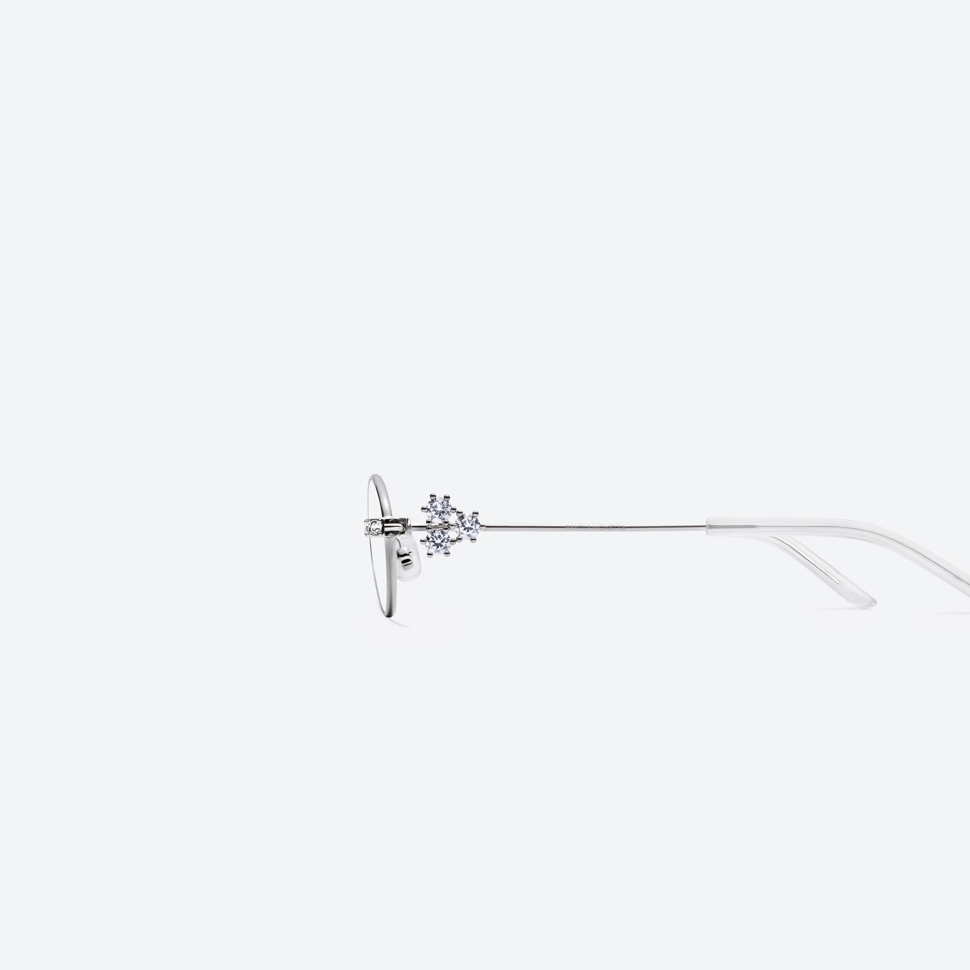 A detailed left view of Gentle Monster Carat 02 Silver Metal framed Oval sunglasses.