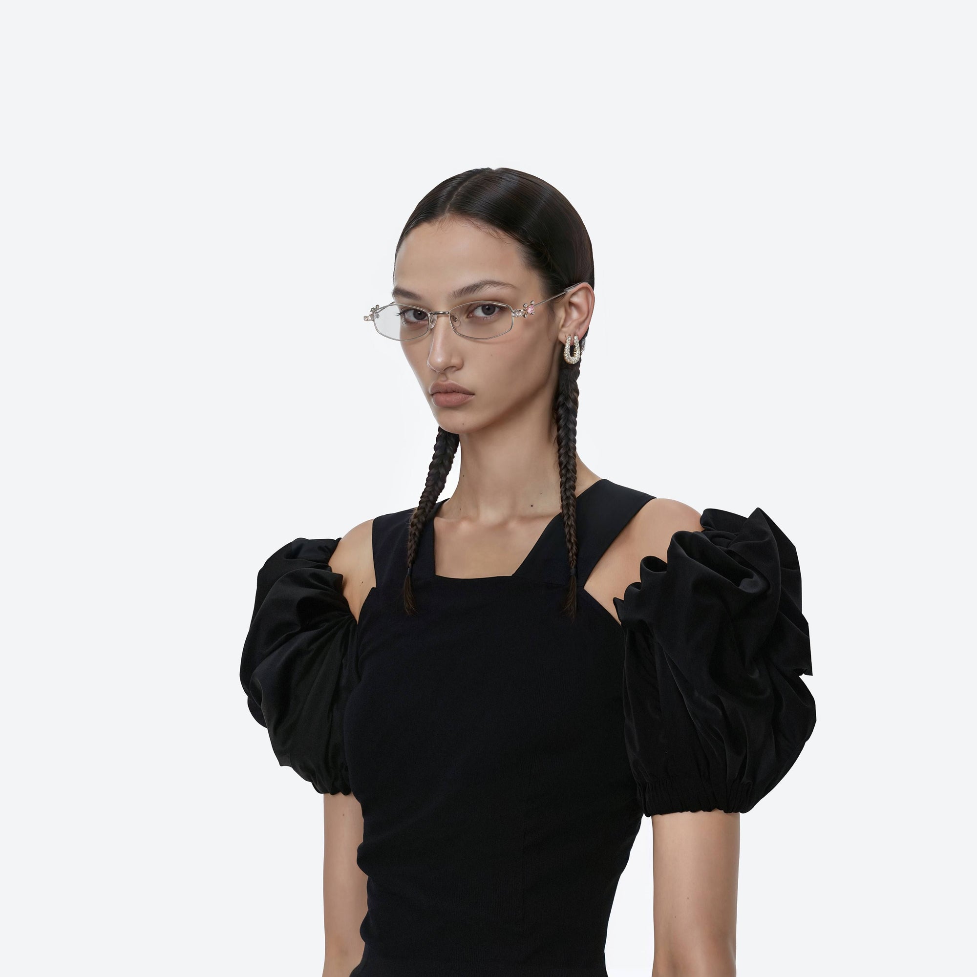 Model wearing the Gleam 02 Silver Metal framed Oval sunglasses.