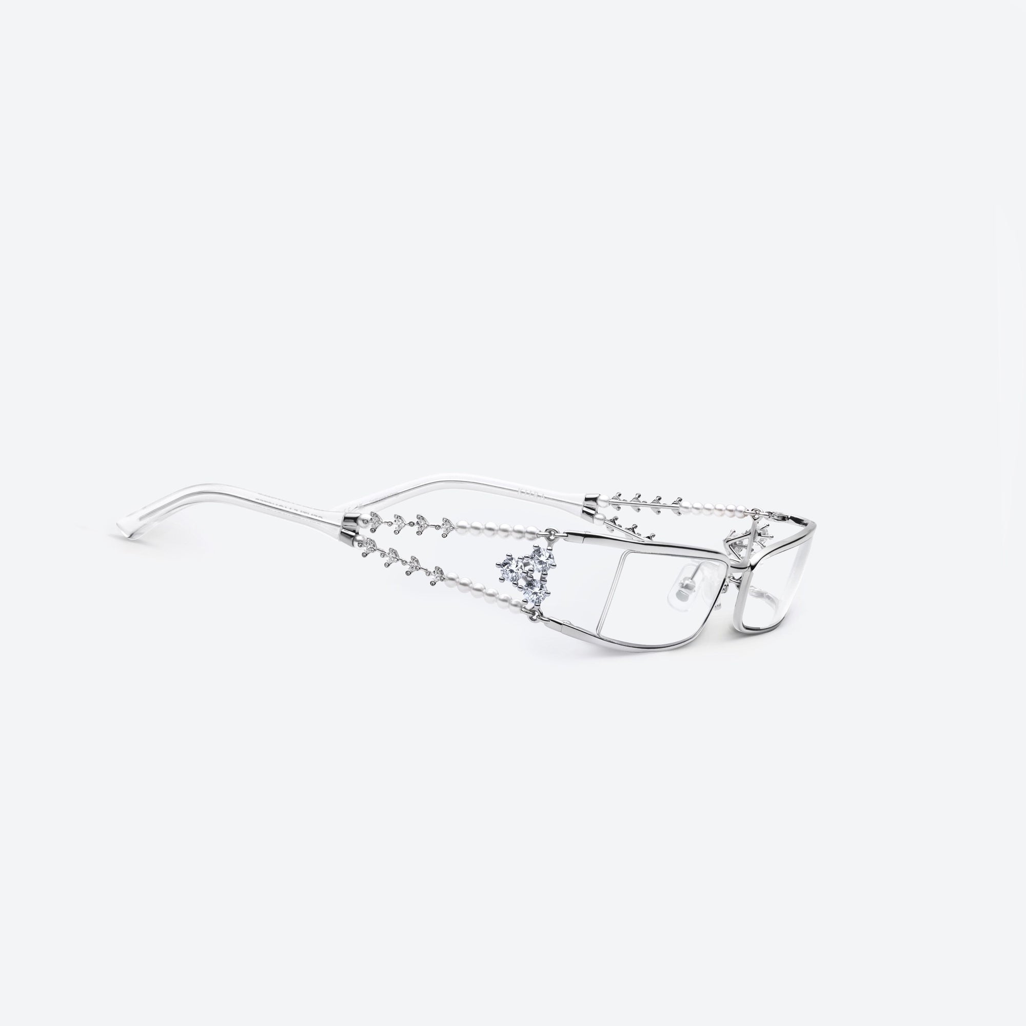 45-degree detailed view of Gentle Monster Kiira 02 Silver Metal framed Square sunglasses.