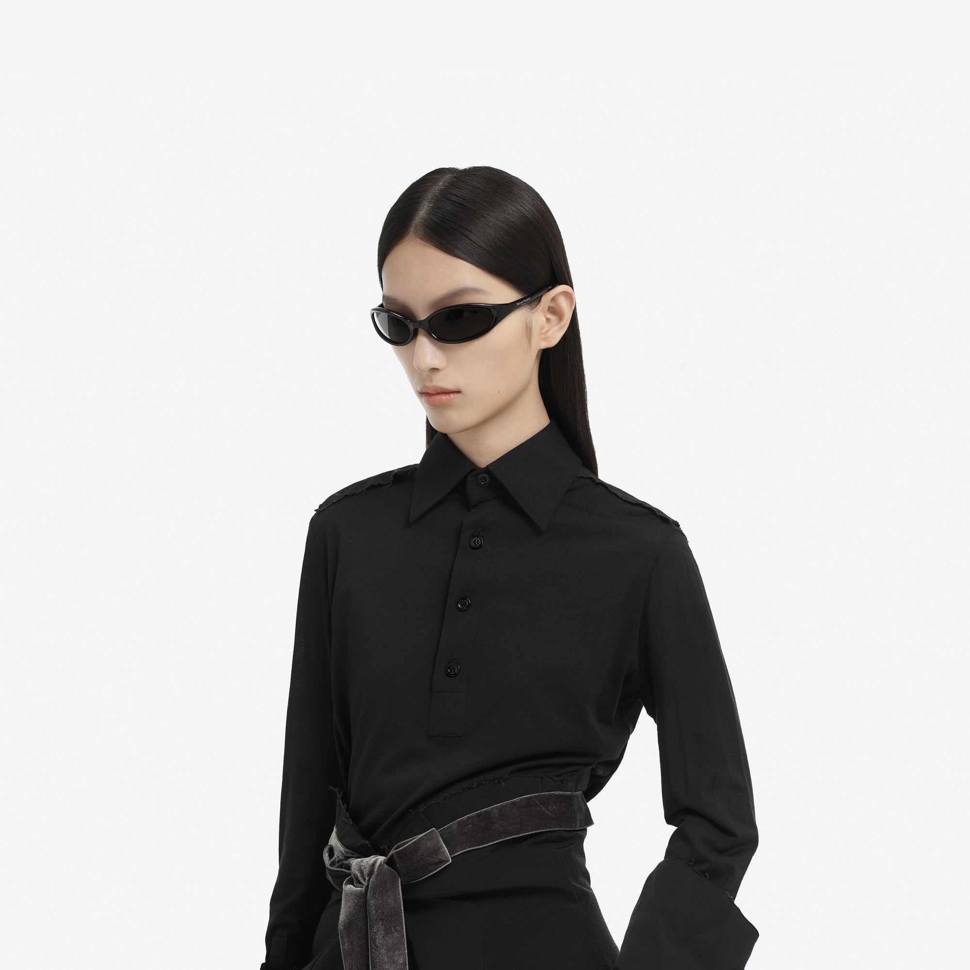 Model wearing the Maison Margiela - MM202 01 Black Acetate framed Wraparound sunglasses.