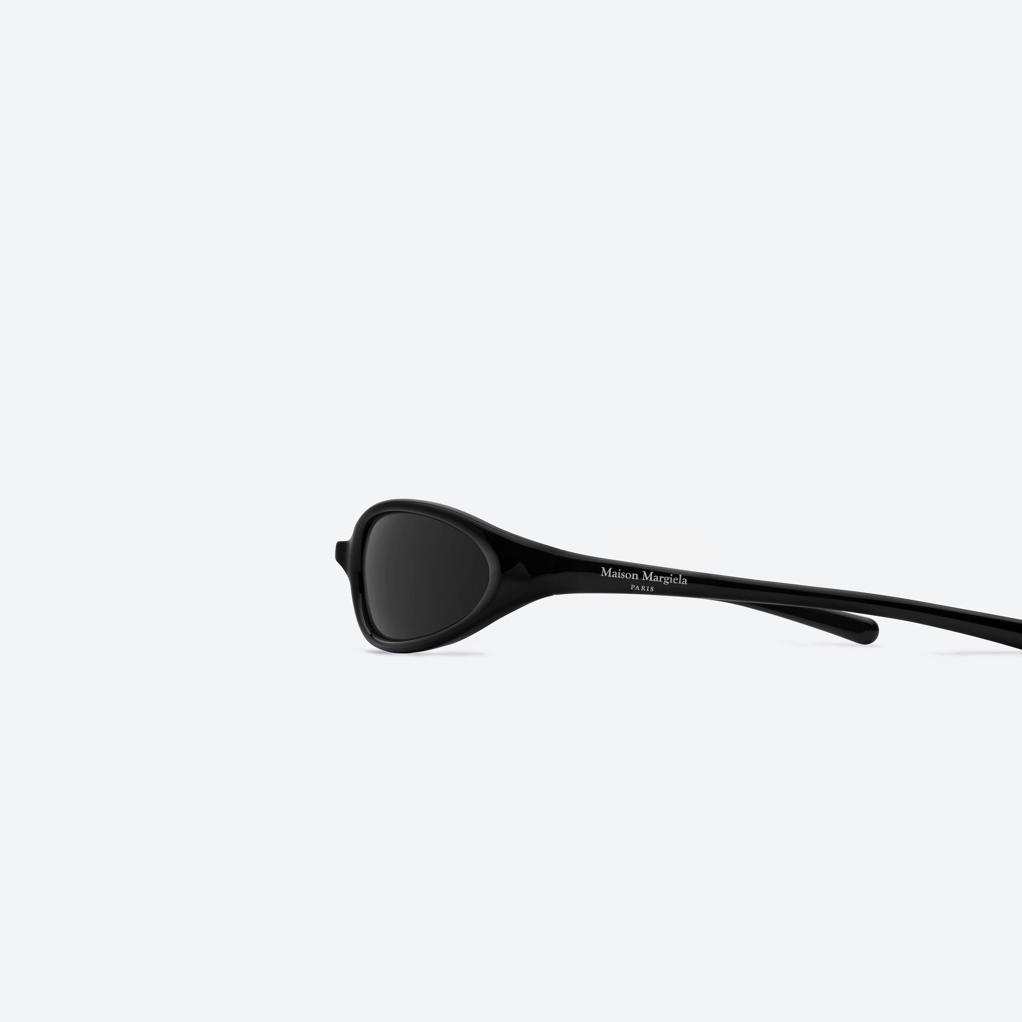 A detailed left view of Gentle Monster Maison Margiela - MM202 01 Black Acetate framed Wraparound sunglasses.