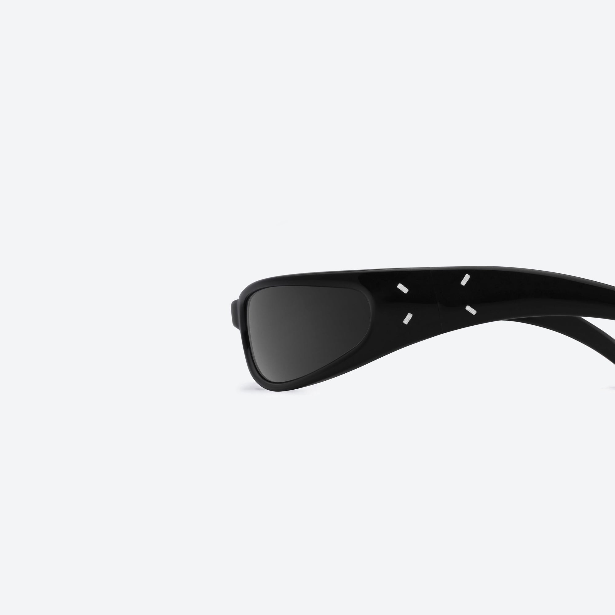 A detailed left view of Gentle Monster Maison Margiela - MM203 01 Black Acetate framed Wraparound sunglasses.