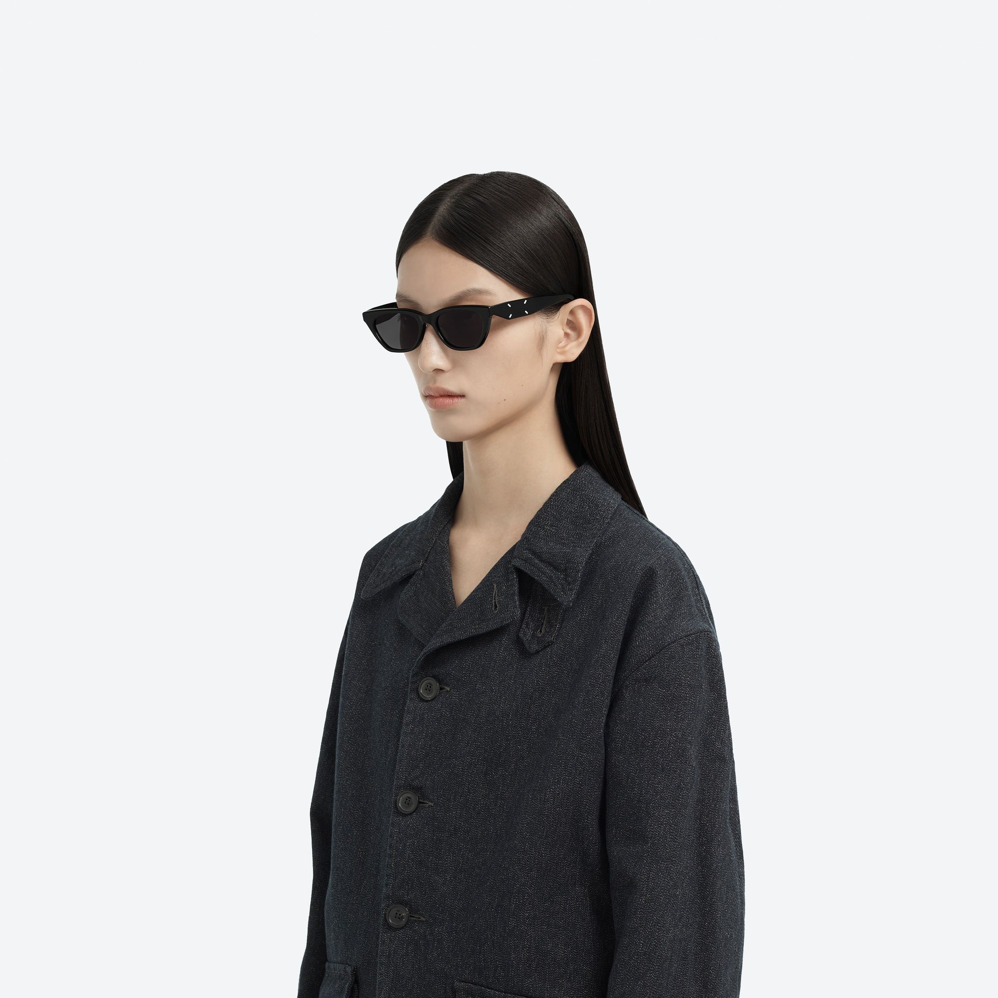 Model wearing the Maison Margiela - MM208 01 Black Acetate framed Cat-eye sunglasses.