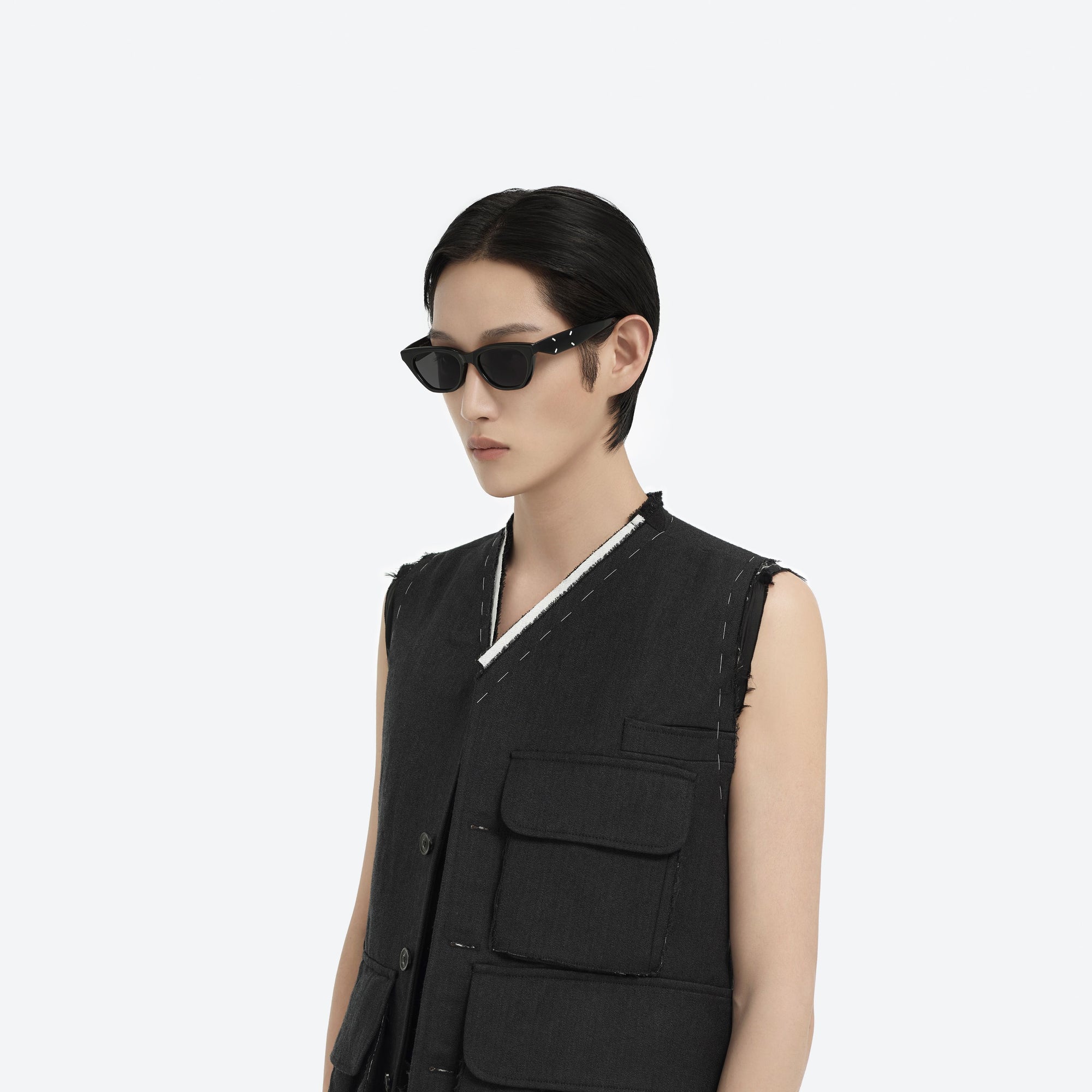 Model wearing the Maison Margiela - MM208 01 Black Acetate framed Cat-eye sunglasses.