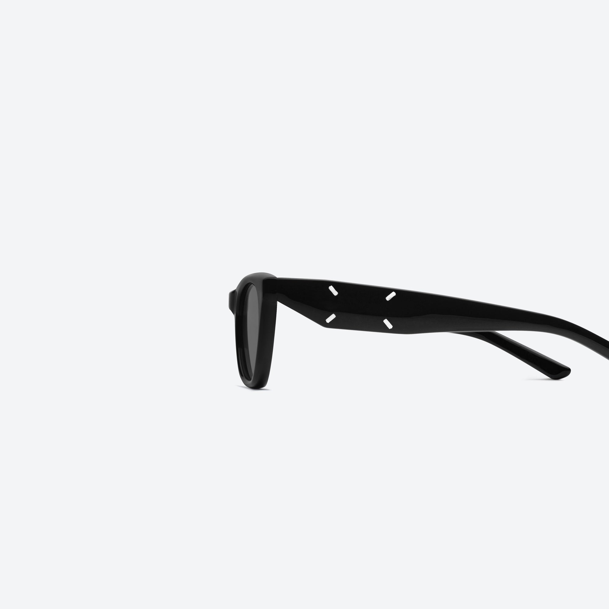 A detailed left view of Gentle Monster Maison Margiela - MM208 01 Black Acetate framed Cat-eye sunglasses.