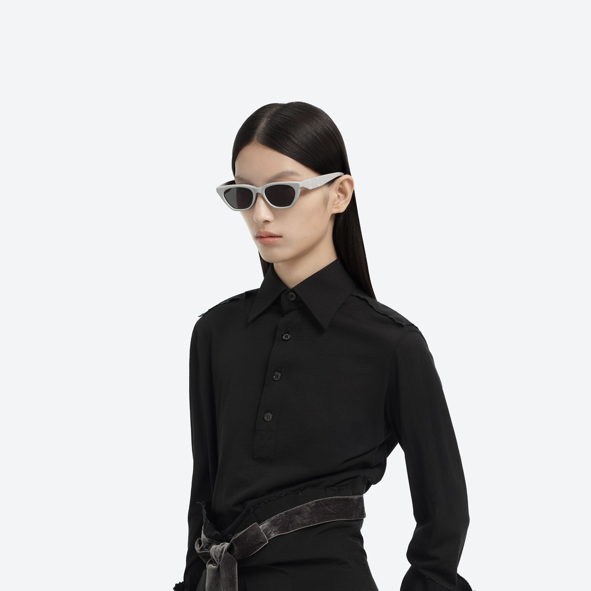 Model wearing the Maison Margiela - MM208 G12 Gray Acetate framed Cat-eye sunglasses.