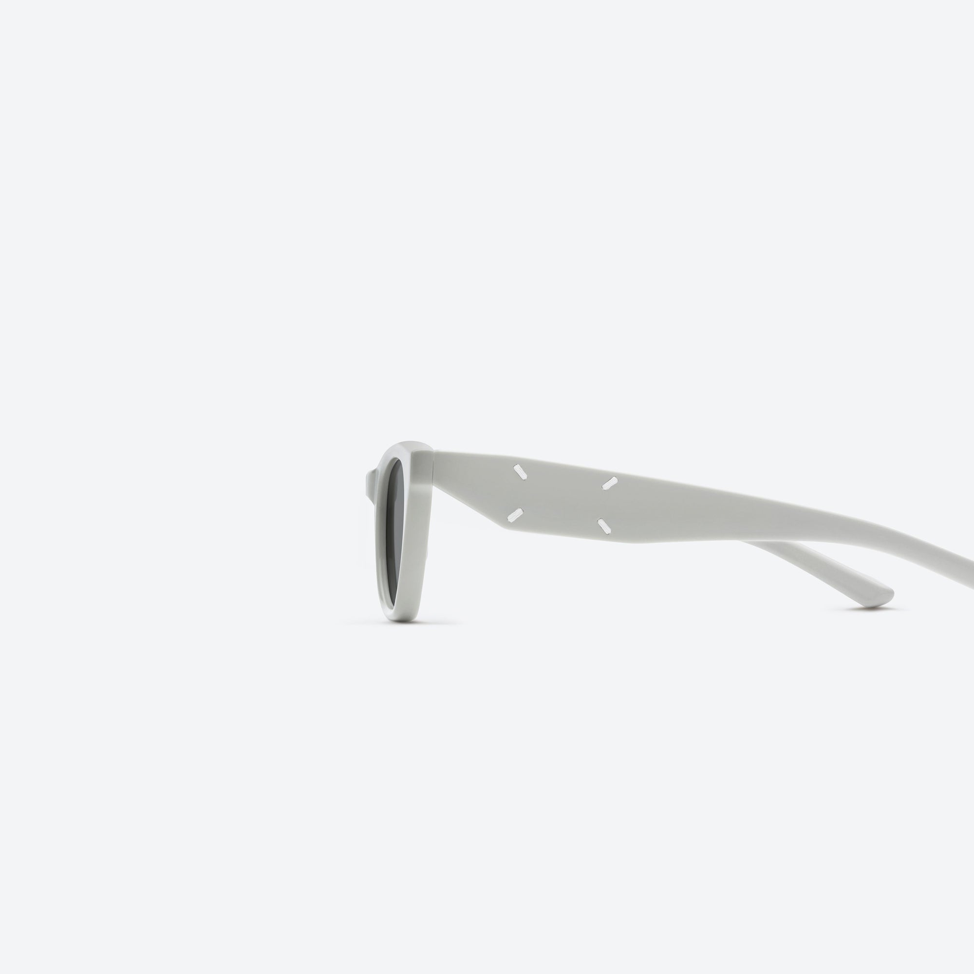 A detailed left view of Gentle Monster Maison Margiela - MM208 G12 Gray Acetate framed Cat-eye sunglasses.