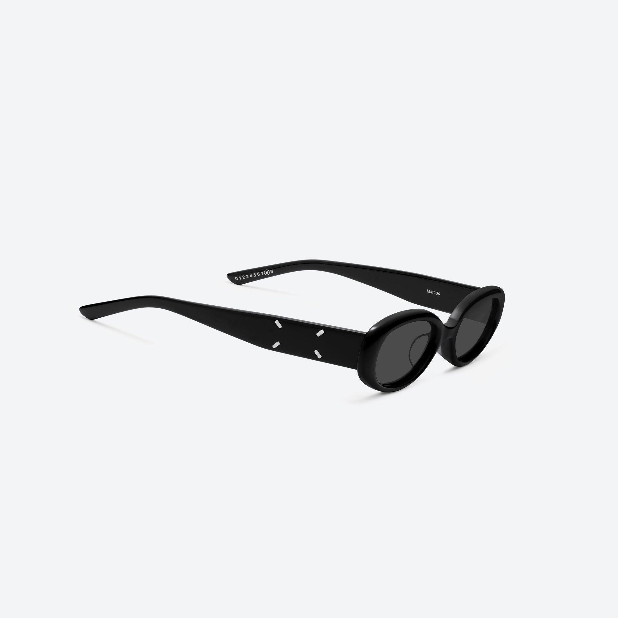 45-degree detailed view of Gentle Monster Maison Margiela - MM206 01 Black Acetate framed Oval sunglasses.