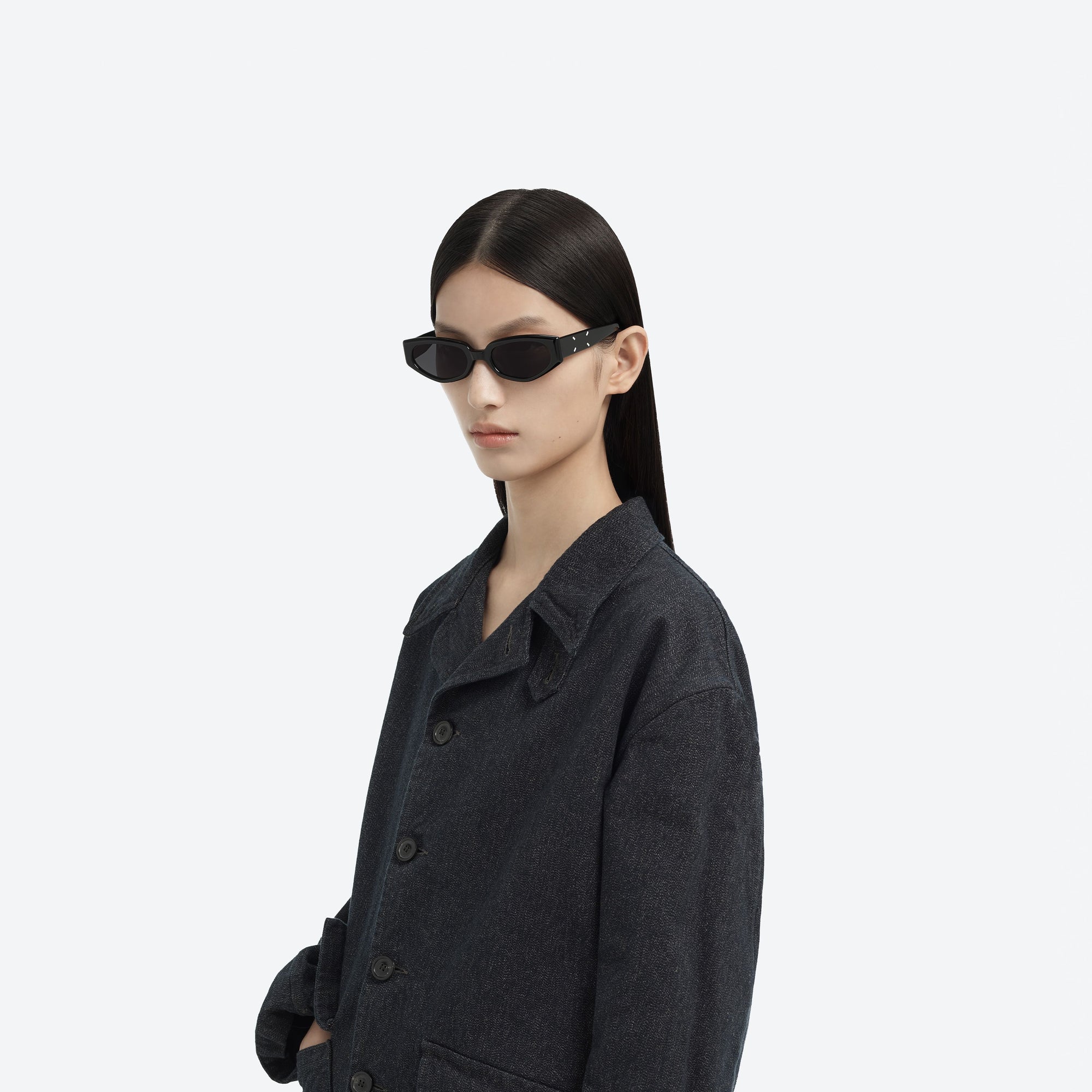 Model wearing the Maison Margiela - MM205 01 Black Acetate framed Cat-eye sunglasses.