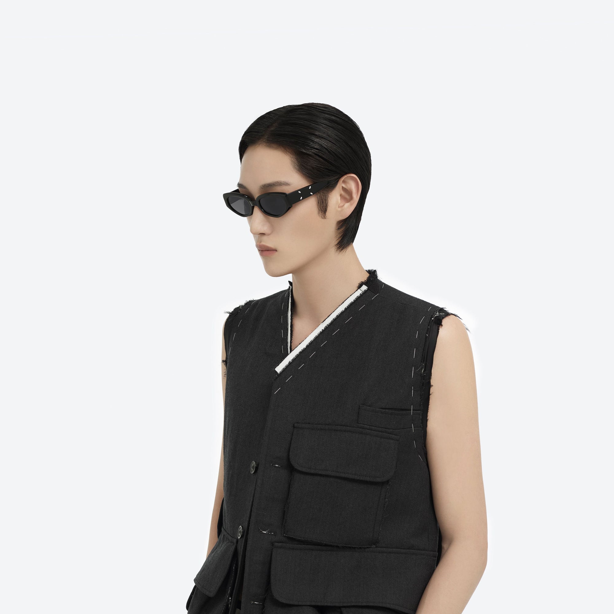 Model wearing the Maison Margiela - MM205 01 Black Acetate framed Cat-eye sunglasses.