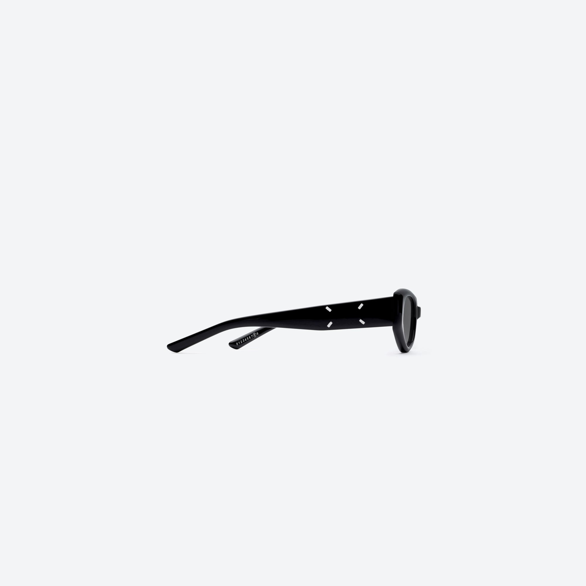 A detailed right view of Gentle Monster Maison Margiela - MM205 01 Black Acetate framed Cat-eye sunglasses.