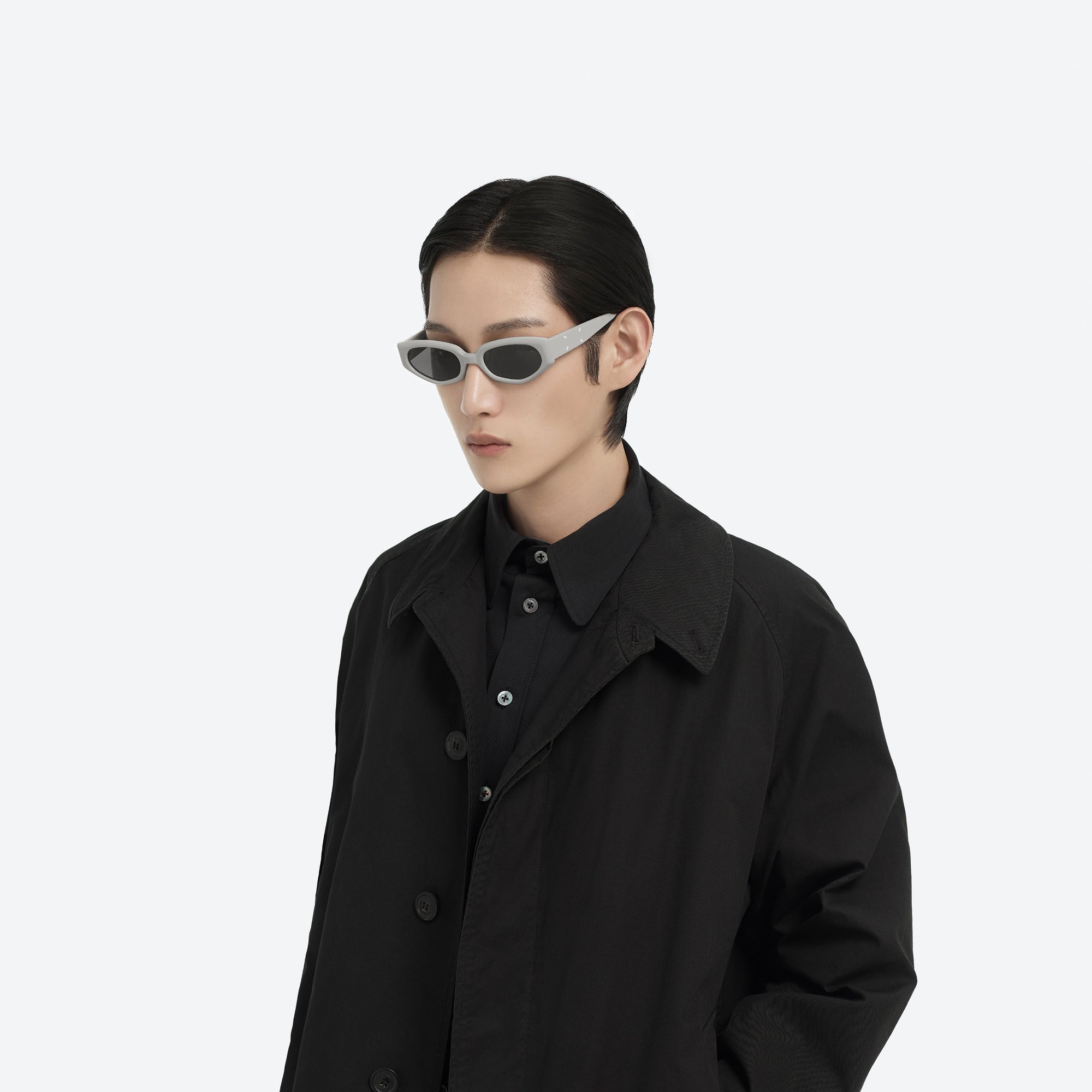 Model wearing the Maison Margiela - MM205 G12 Gray Acetate framed Cat-eye sunglasses.