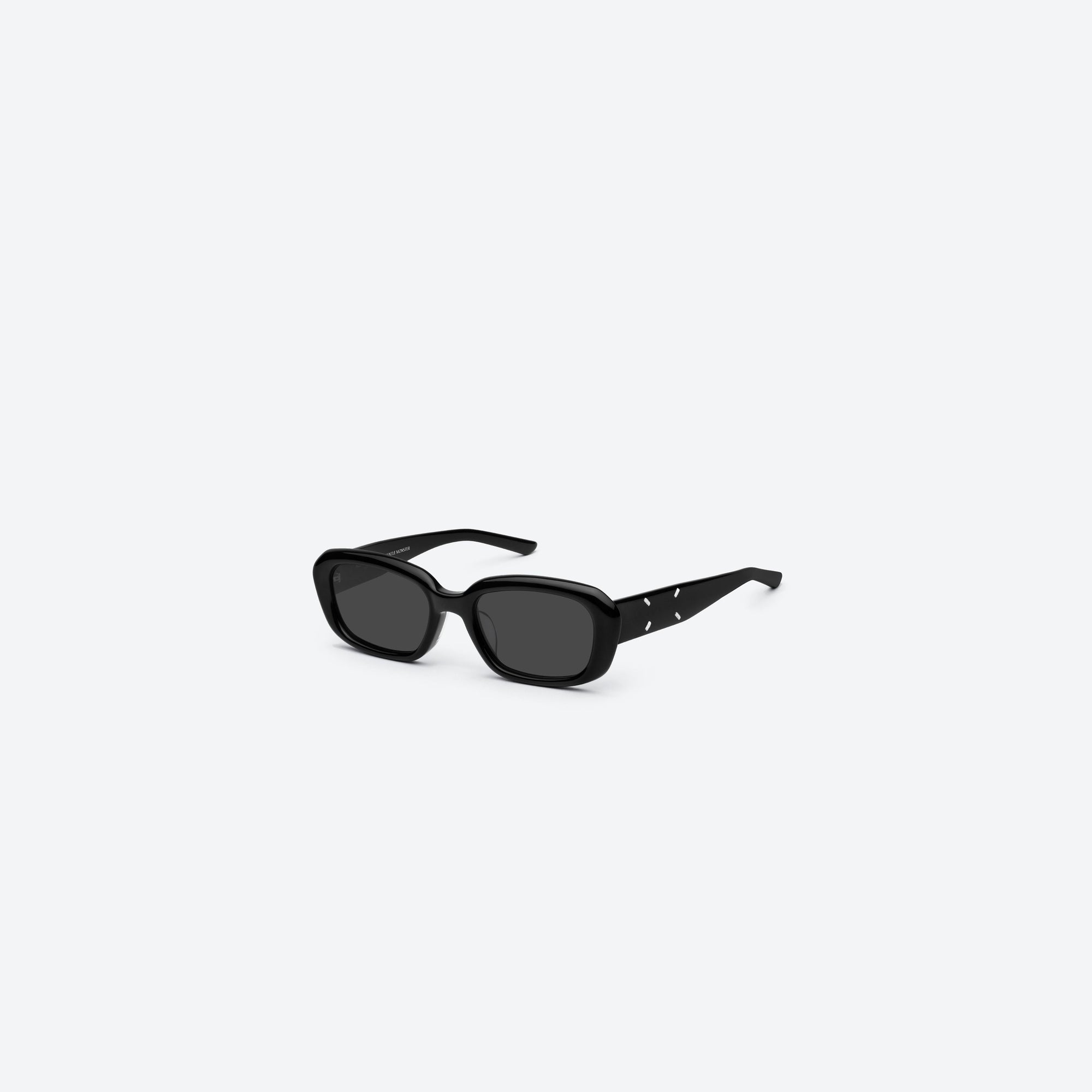 45-degree view of Gentle Monster Maison Margiela - MM207 01 Black Acetate framed Square sunglasses.