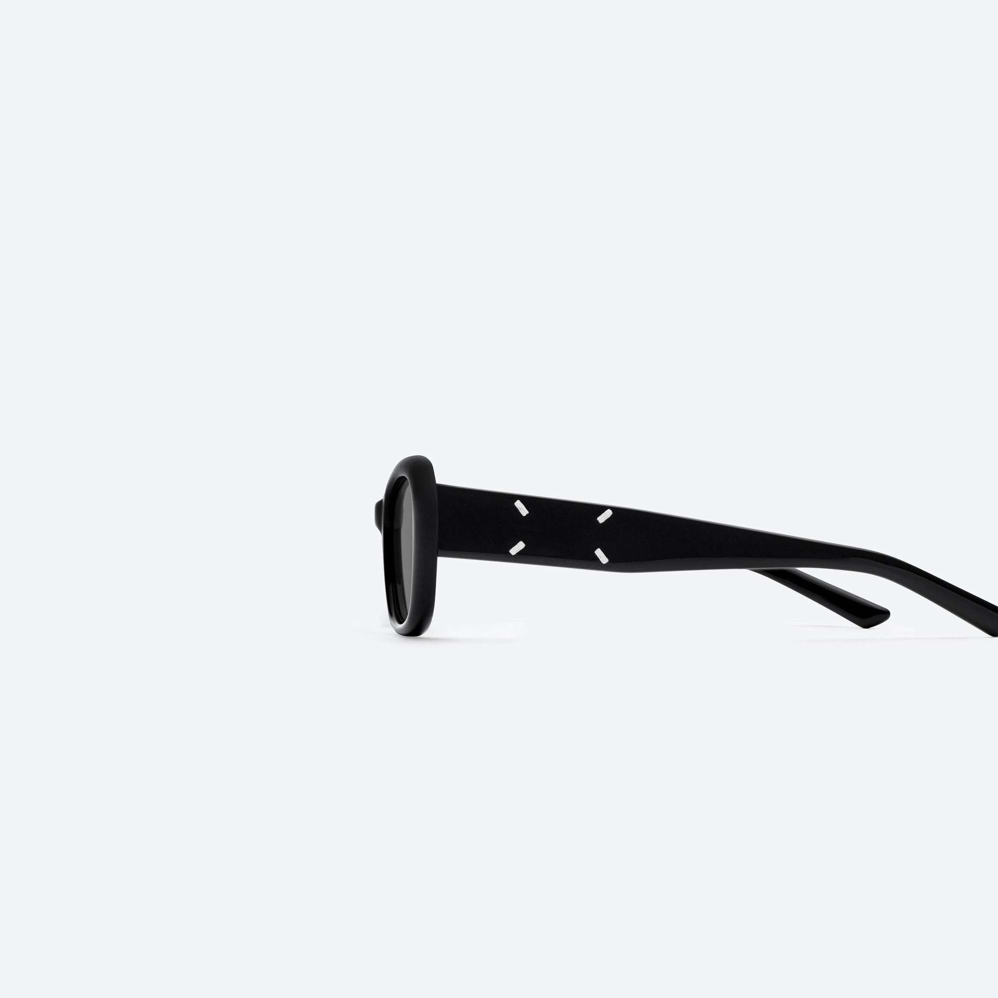 A detailed left view of Gentle Monster Maison Margiela - MM207 01 Black Acetate framed Square sunglasses.